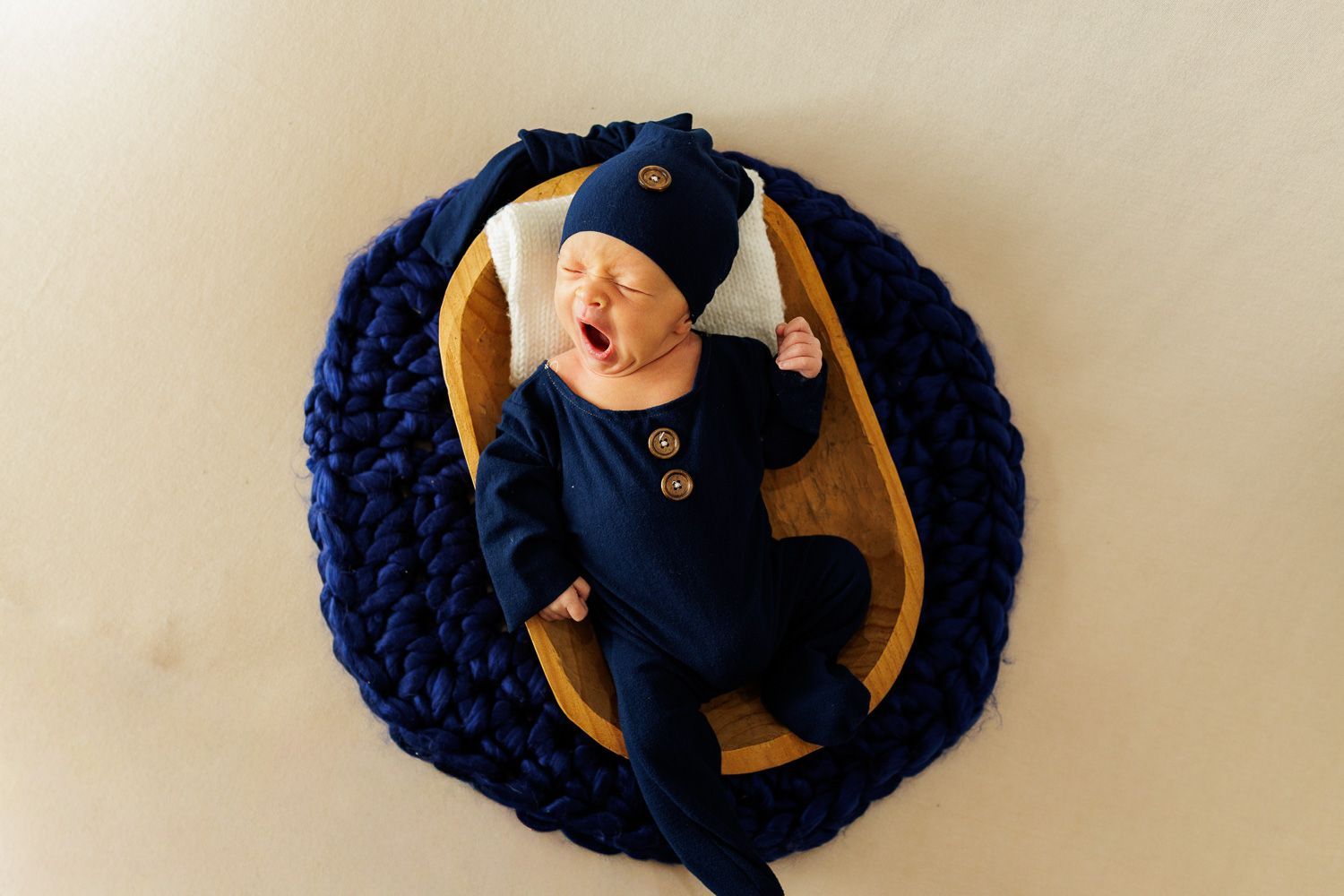 Newborn photography baby boy in blue pajama set