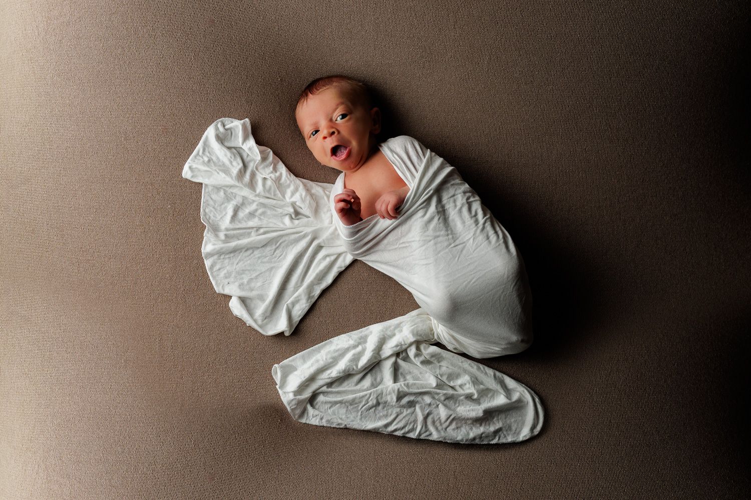 Newborn photography baby boy swaddled