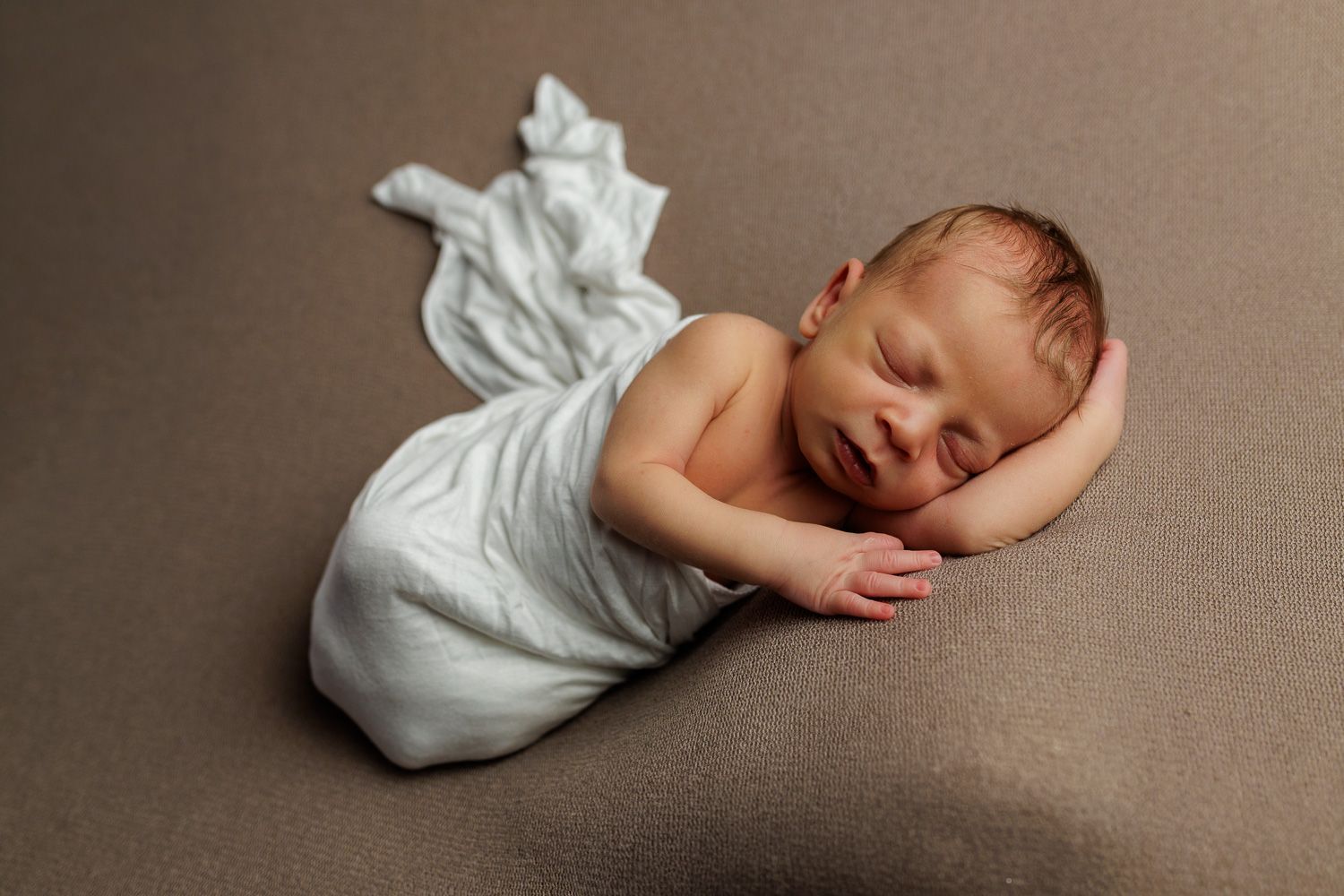 Newborn photography baby boy swaddled