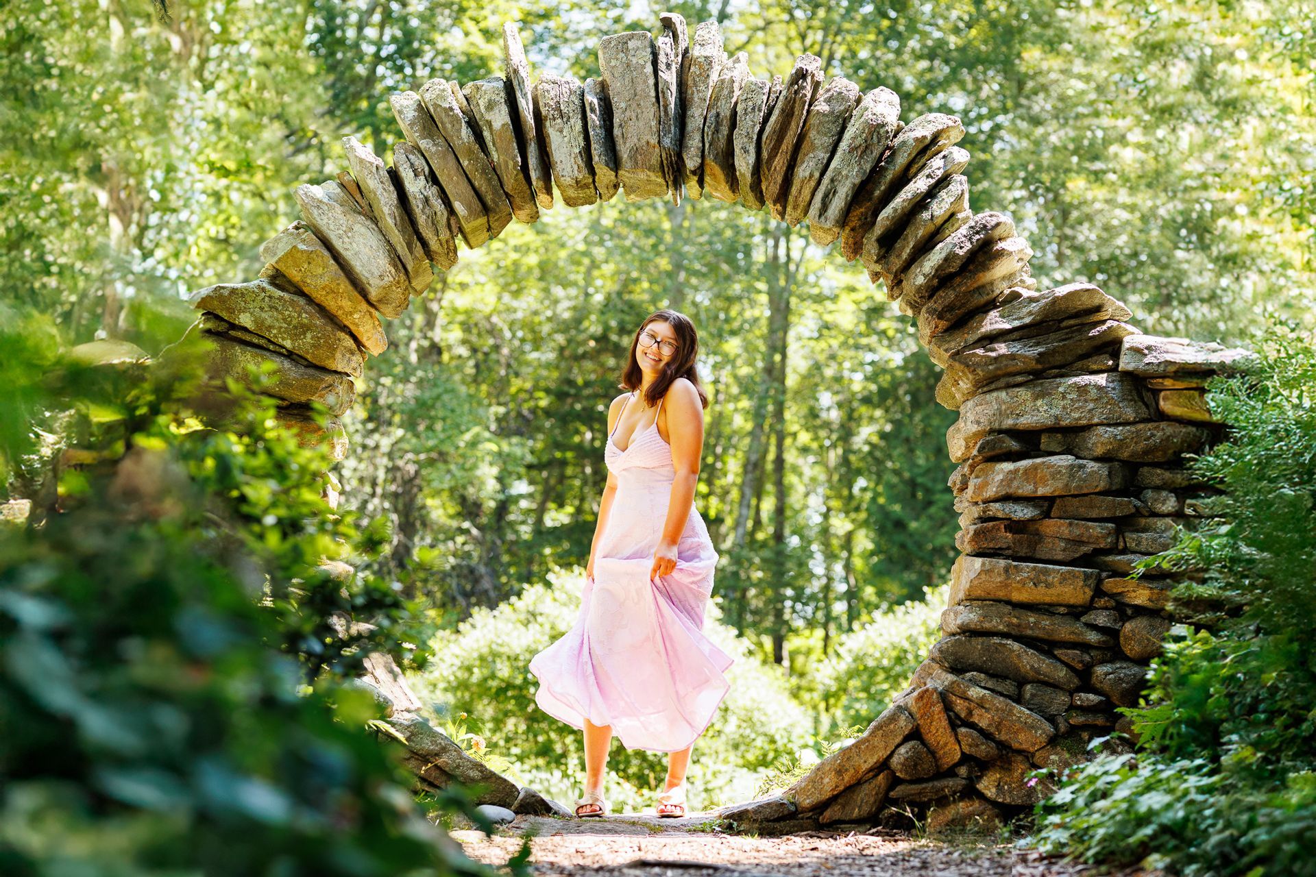 High school senior - senior photography - female student standing in moon arch