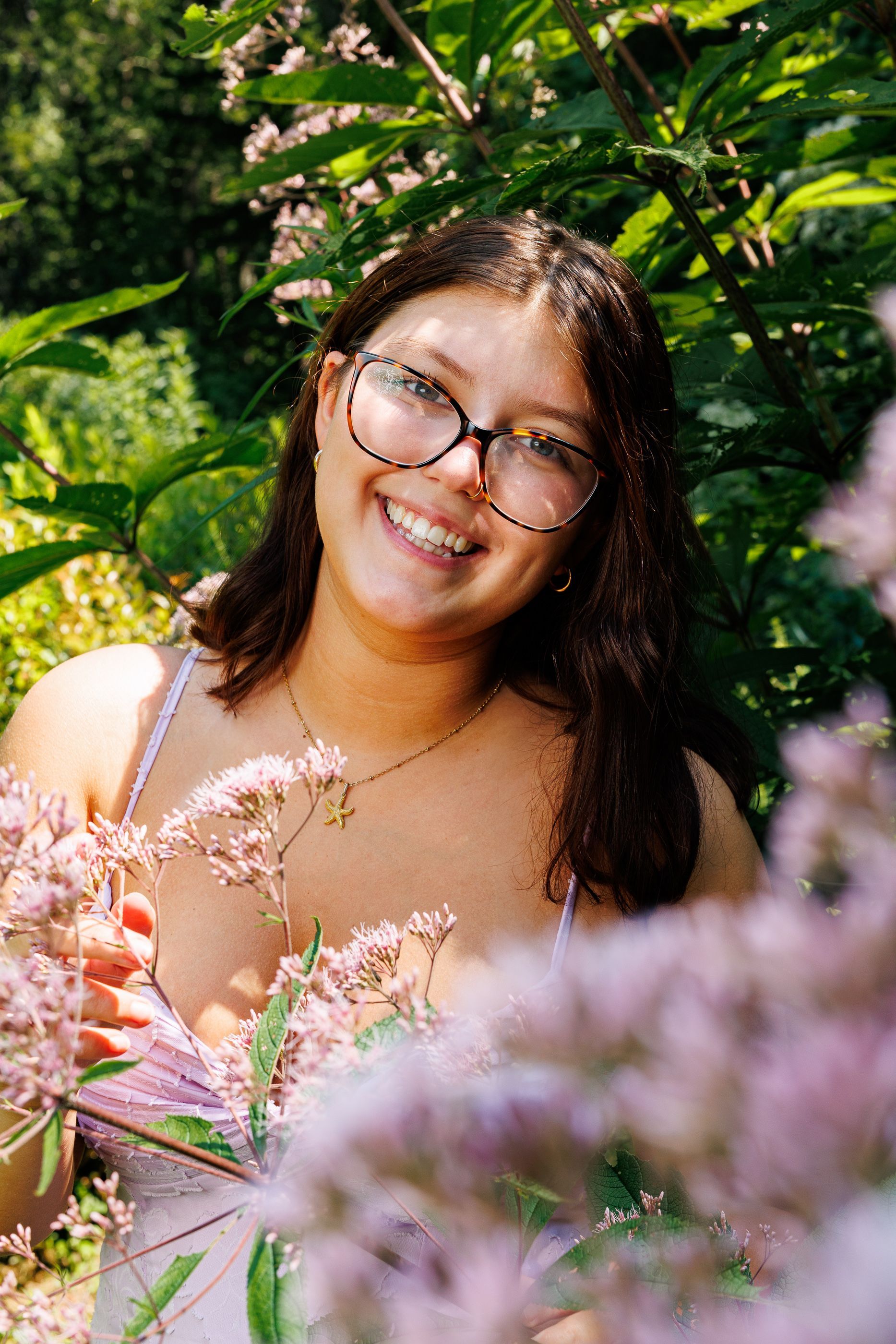 High school senior - senior photography - female student posing in flowers