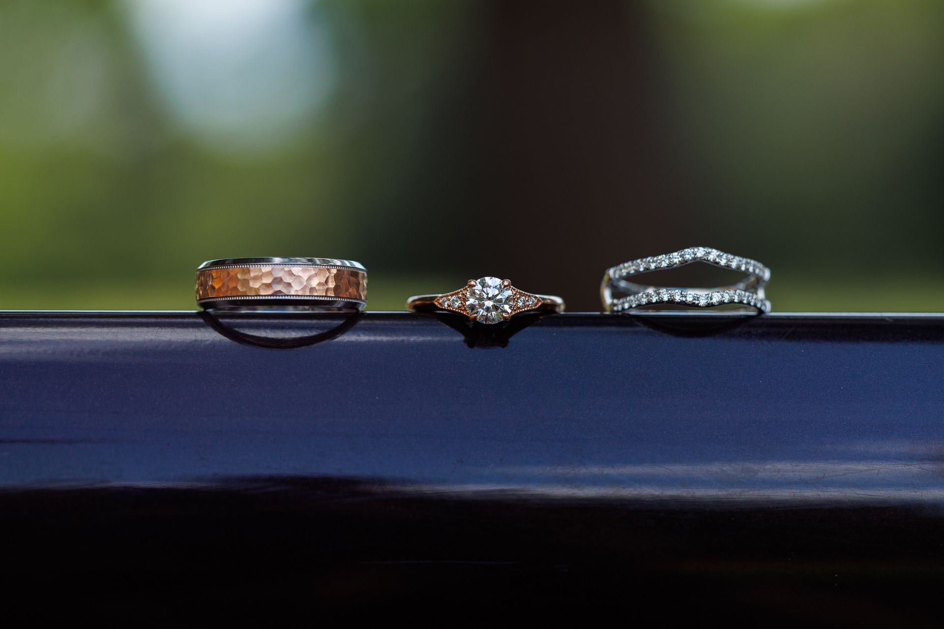 Wedding rings on edge of car