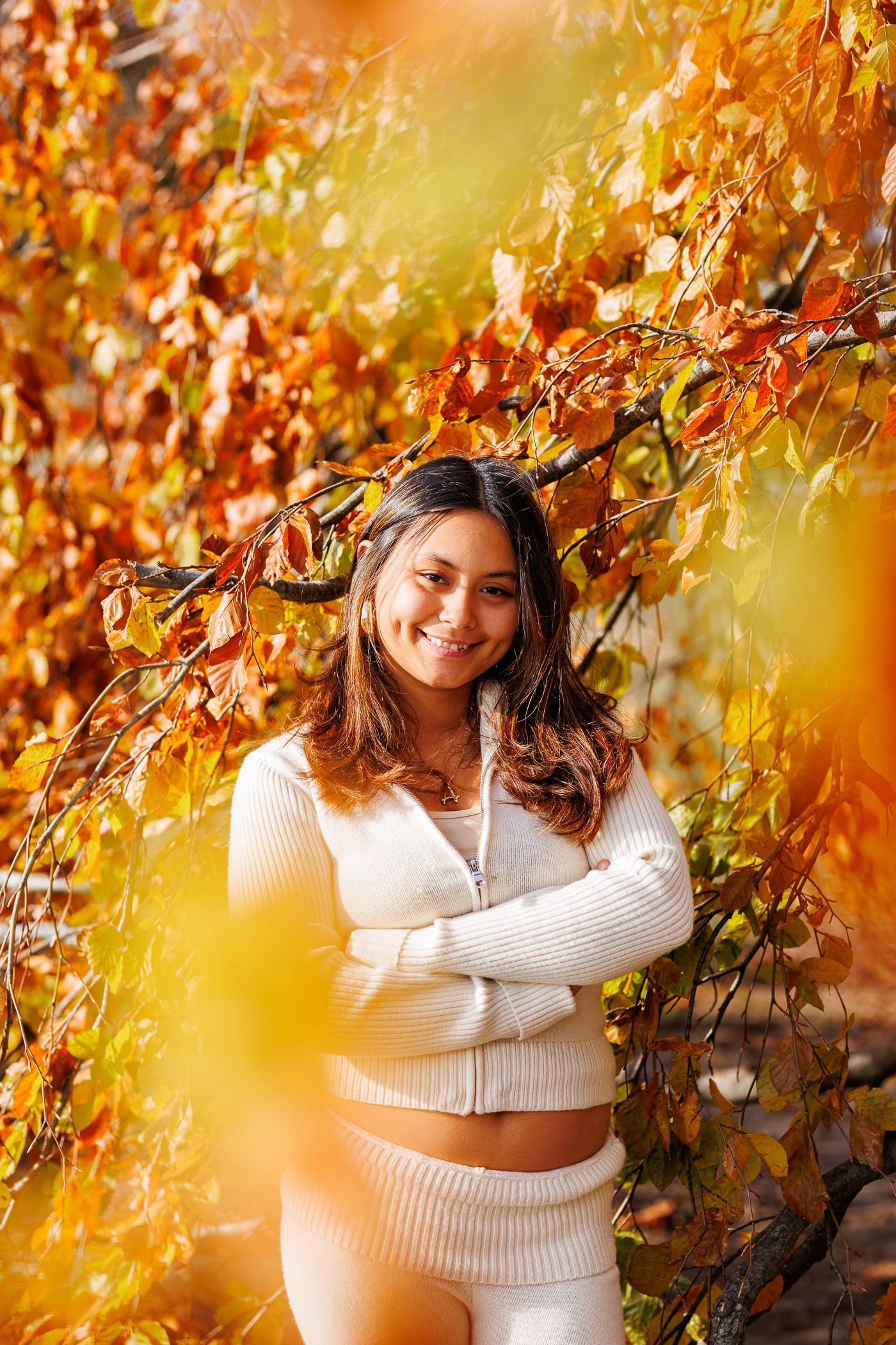 High school senior - senior photography - female student posing in front of tree