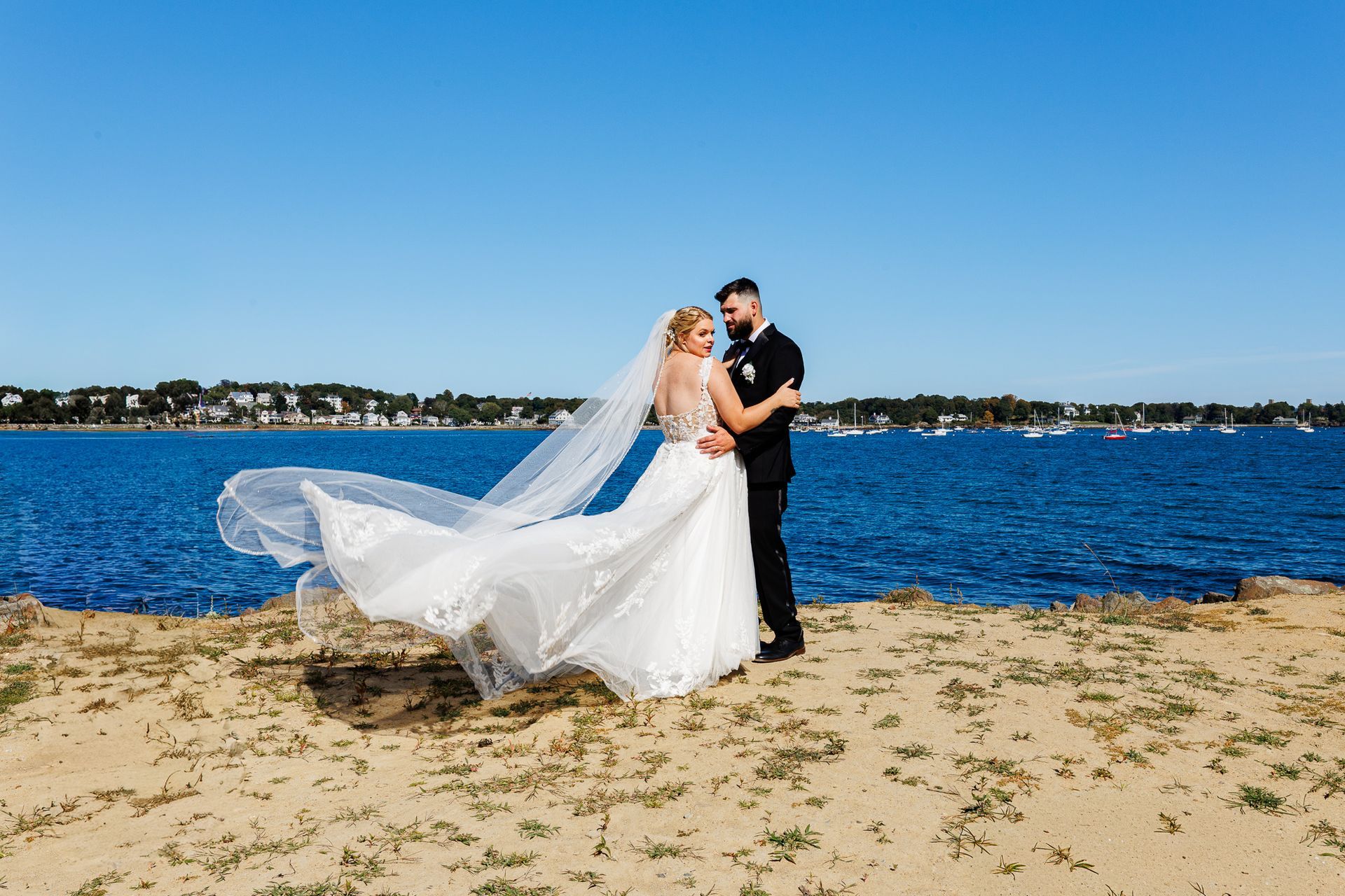 bride and groom posing cliff side at Oceanview, Nahant, MA