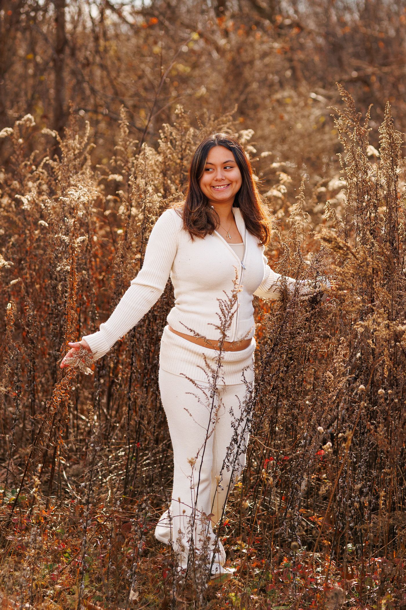 High school senior - senior photography - female student standing in field