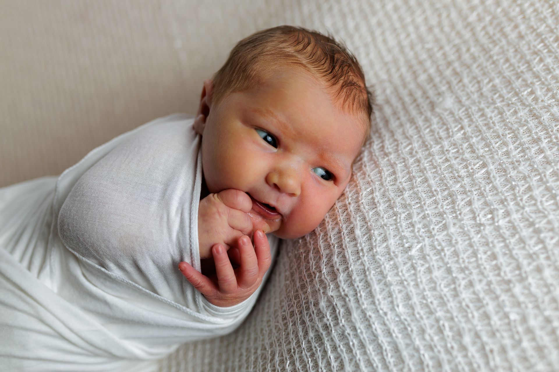 Newborn photography baby girl swaddled