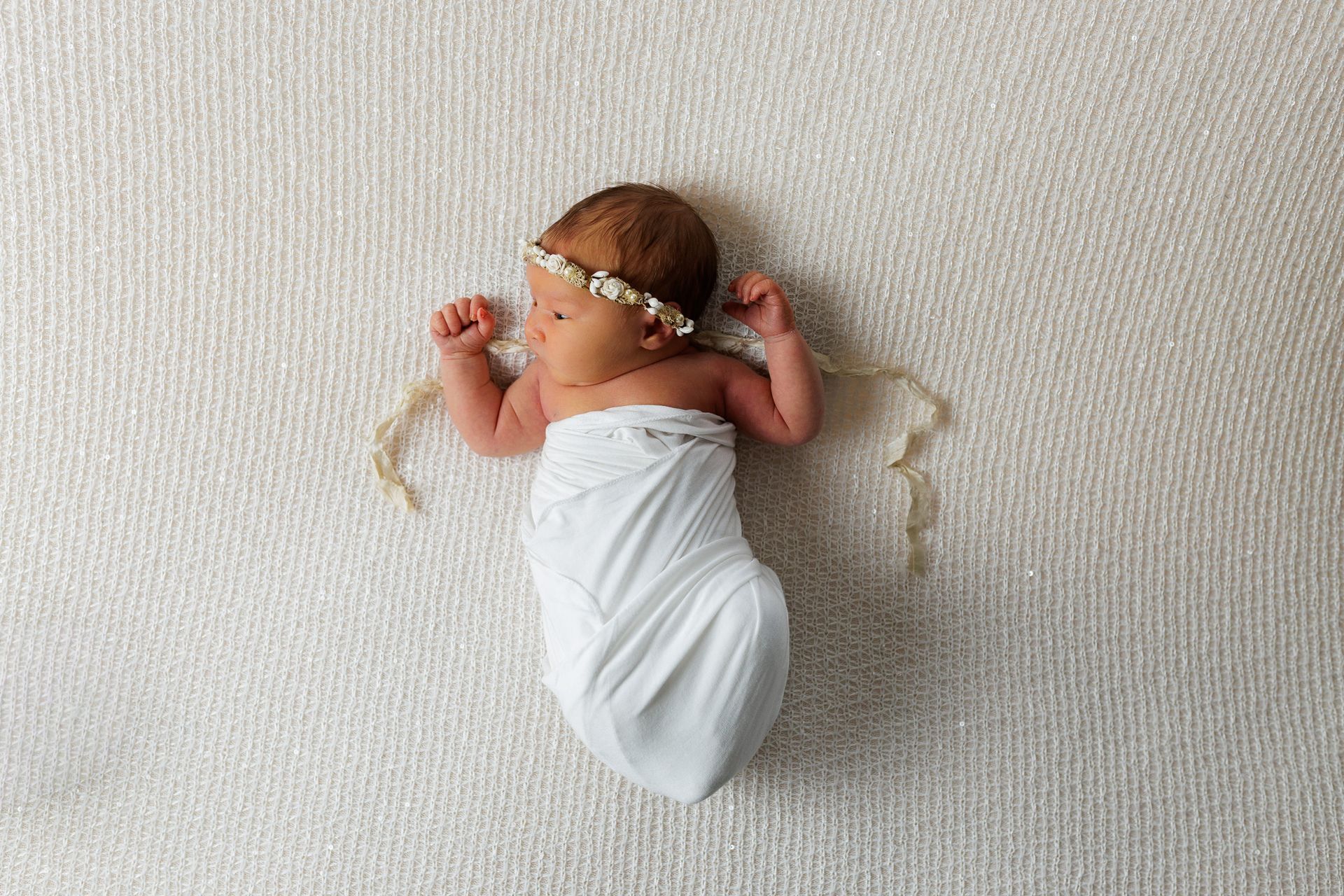 Newborn photography baby girl swaddled