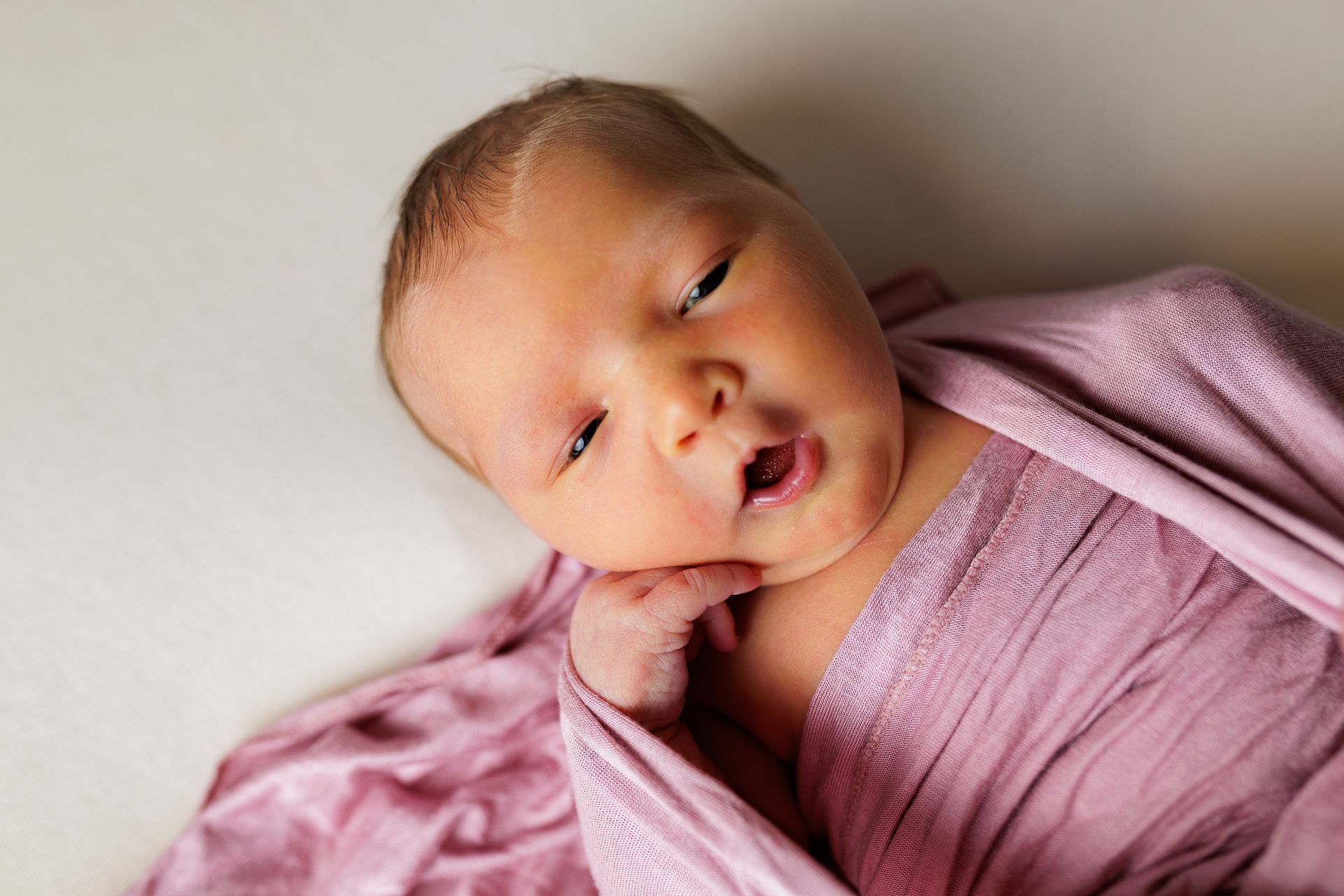 Newborn photography baby girl swaddled