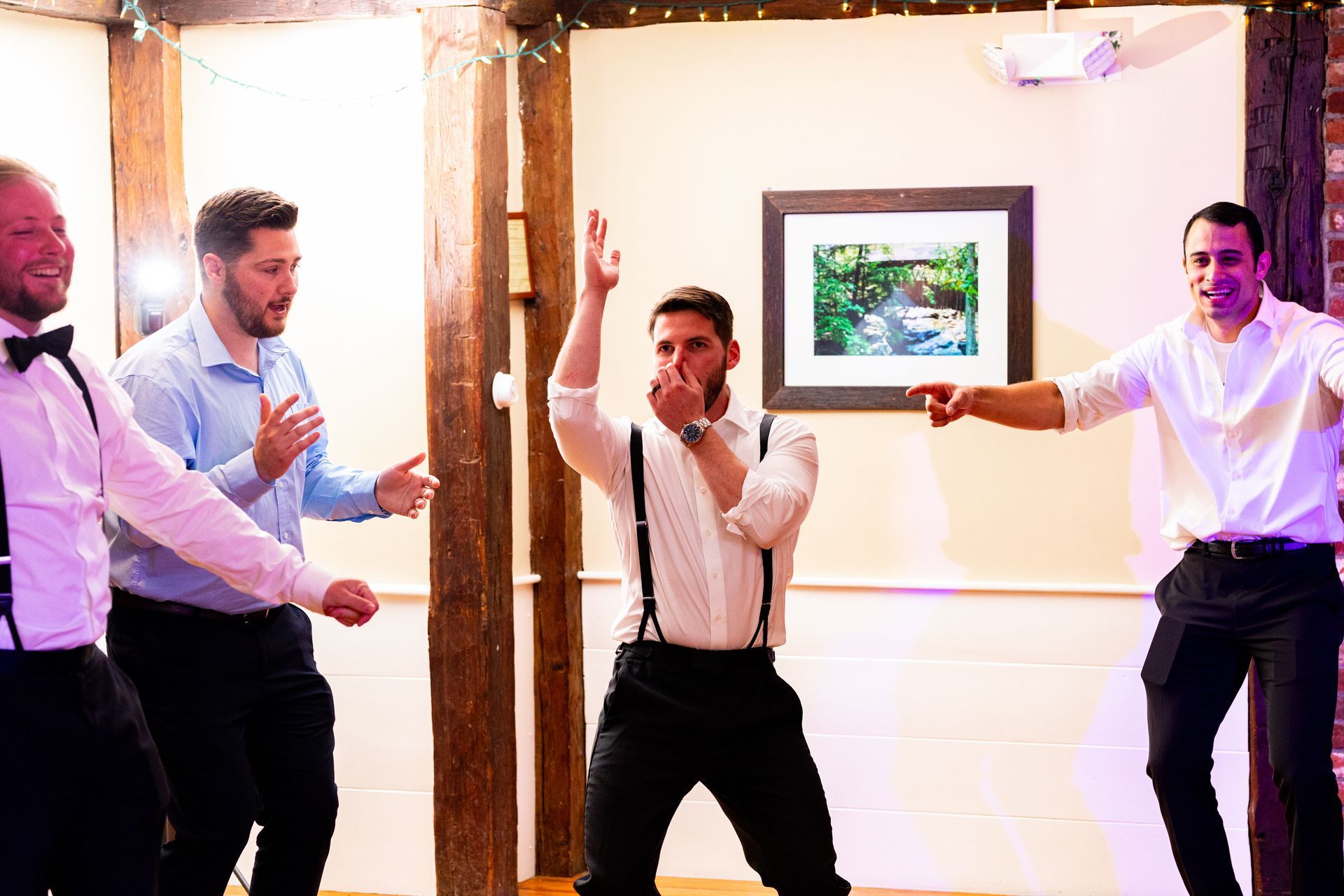 men dancing at reception during wedding at The 1761 Old Mill
