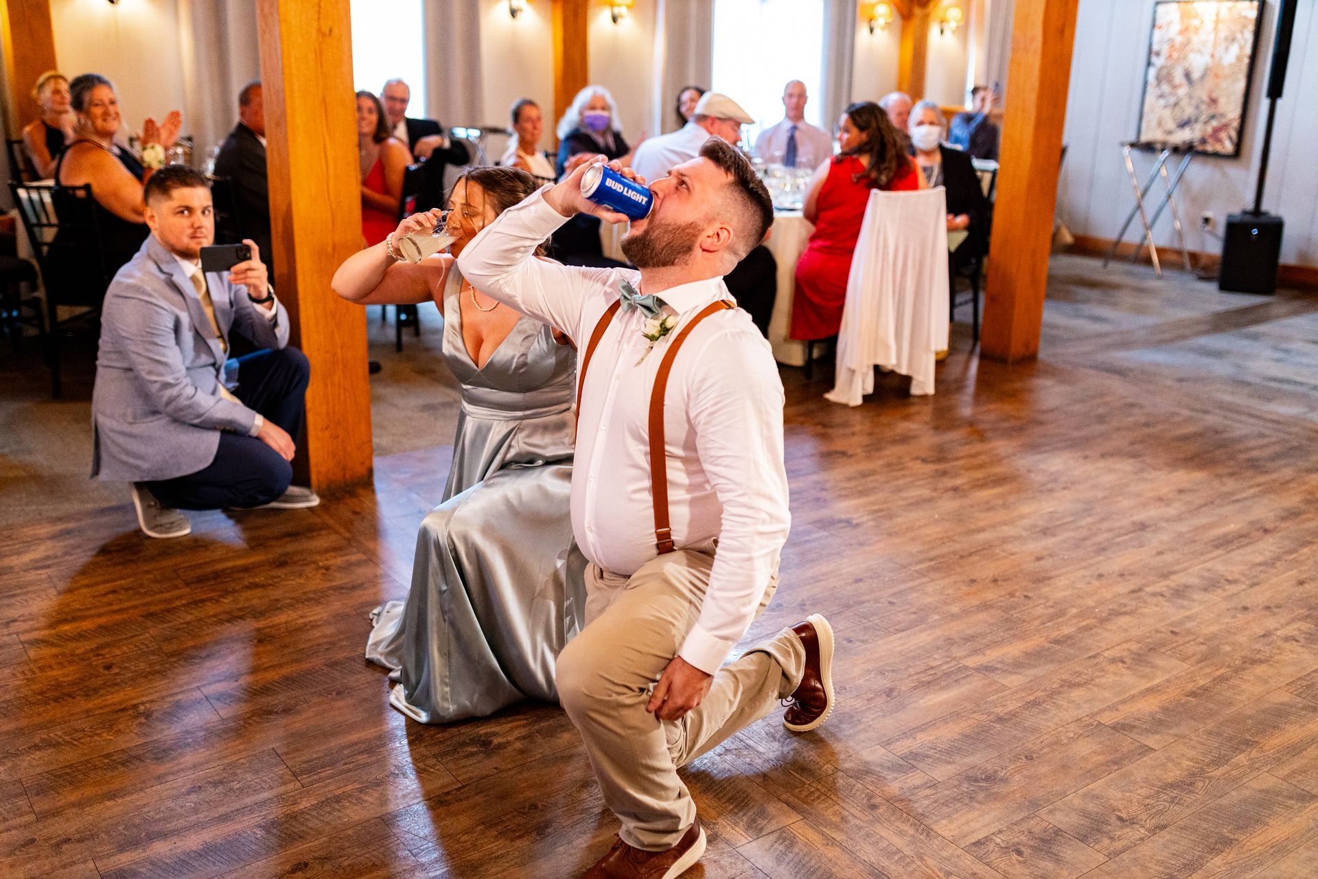 Wedding party entering reception with beer  at Barn at Wight Farm
