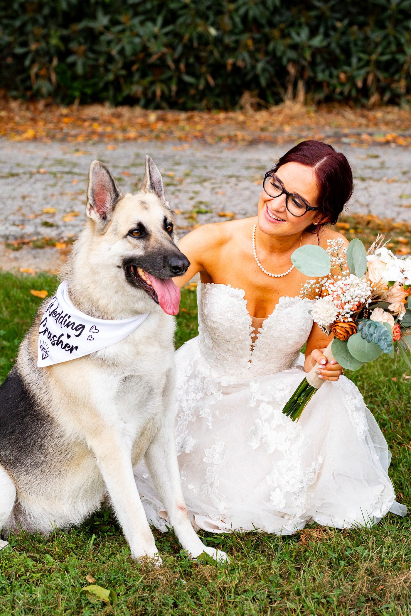 Bride posing with her dog at wedding located at Roseland Park in Woodstock, CT