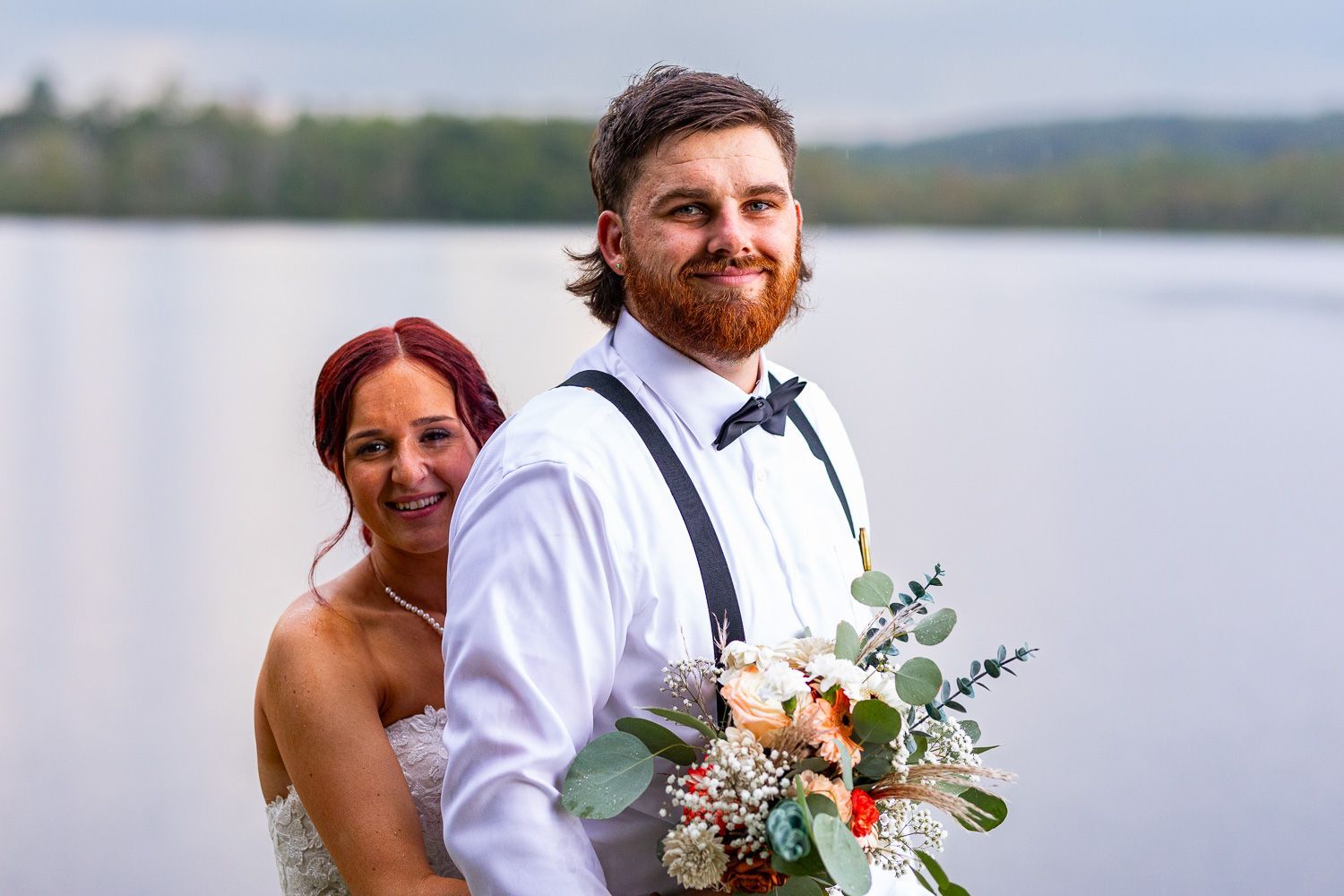 Bride posing with her dog at wedding located at Roseland Park in Woodstock, CT