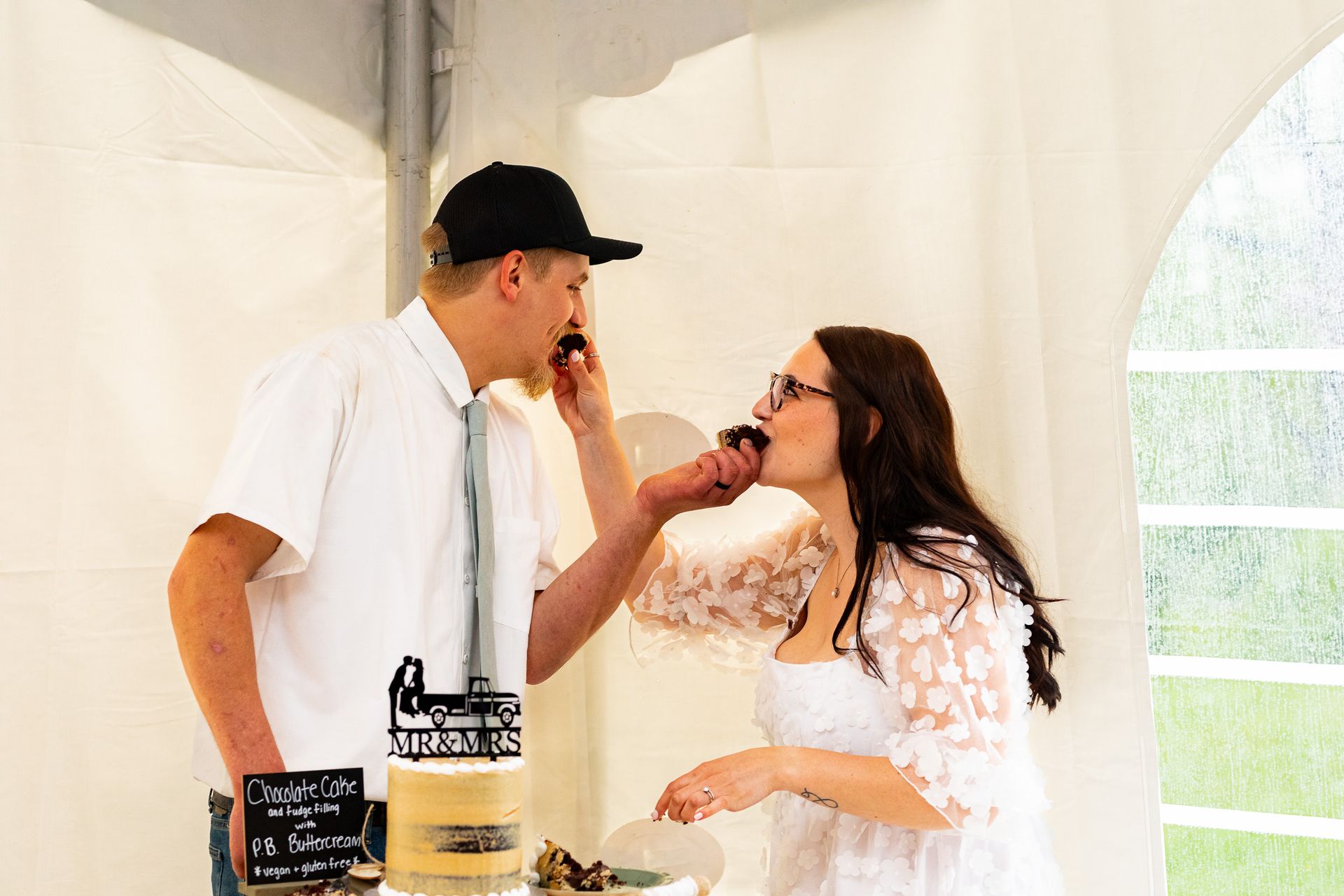 Couple sharing cake at wedding at Elm Hill Farm in Brookfield, MA