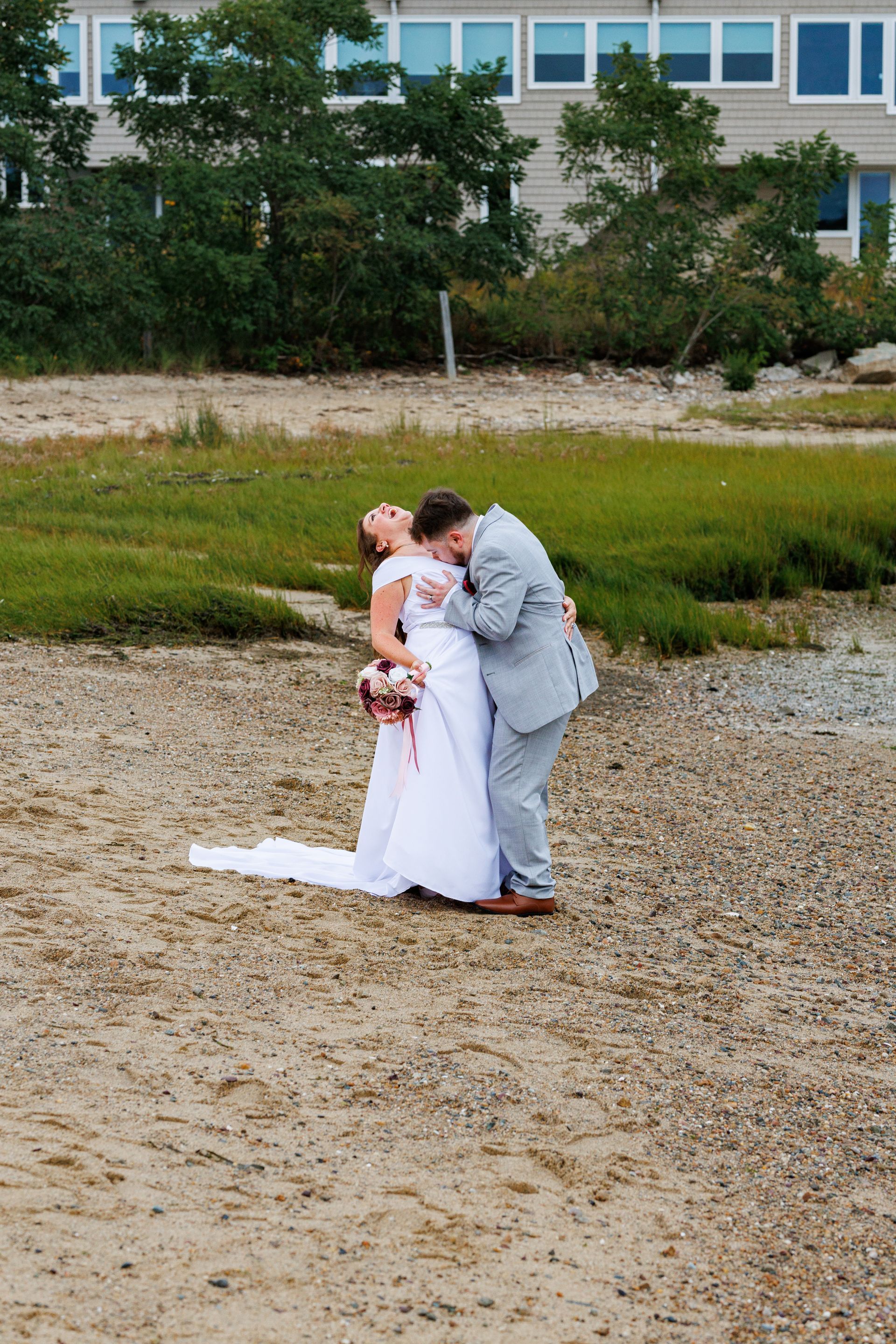 Funny photo of wedding couple on the beach  at hotel Plymouth 1620