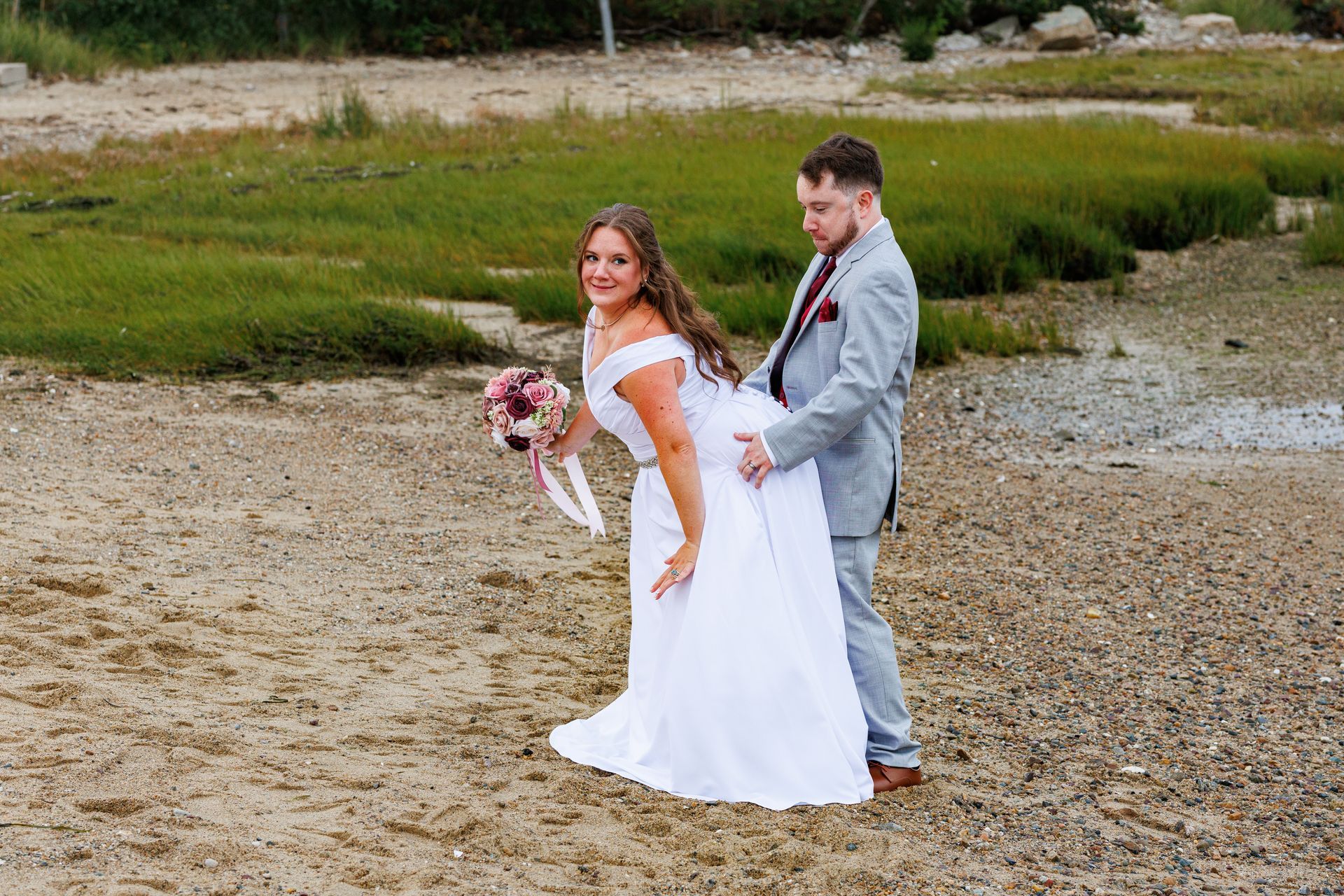 Funny photo of wedding couple on the beach  at hotel Plymouth 1620