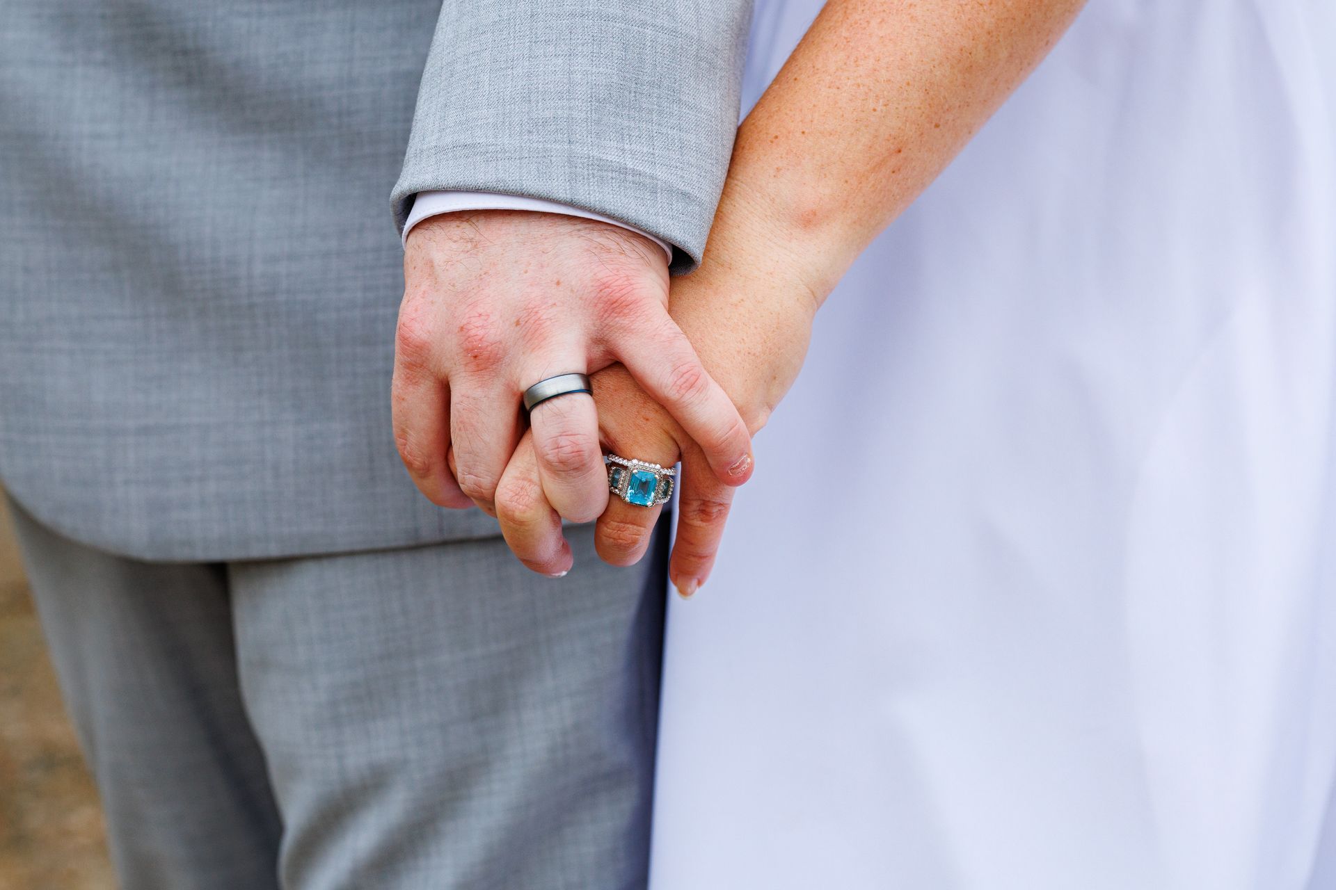 close up of couples wedding rings at hotel Plymouth 1620