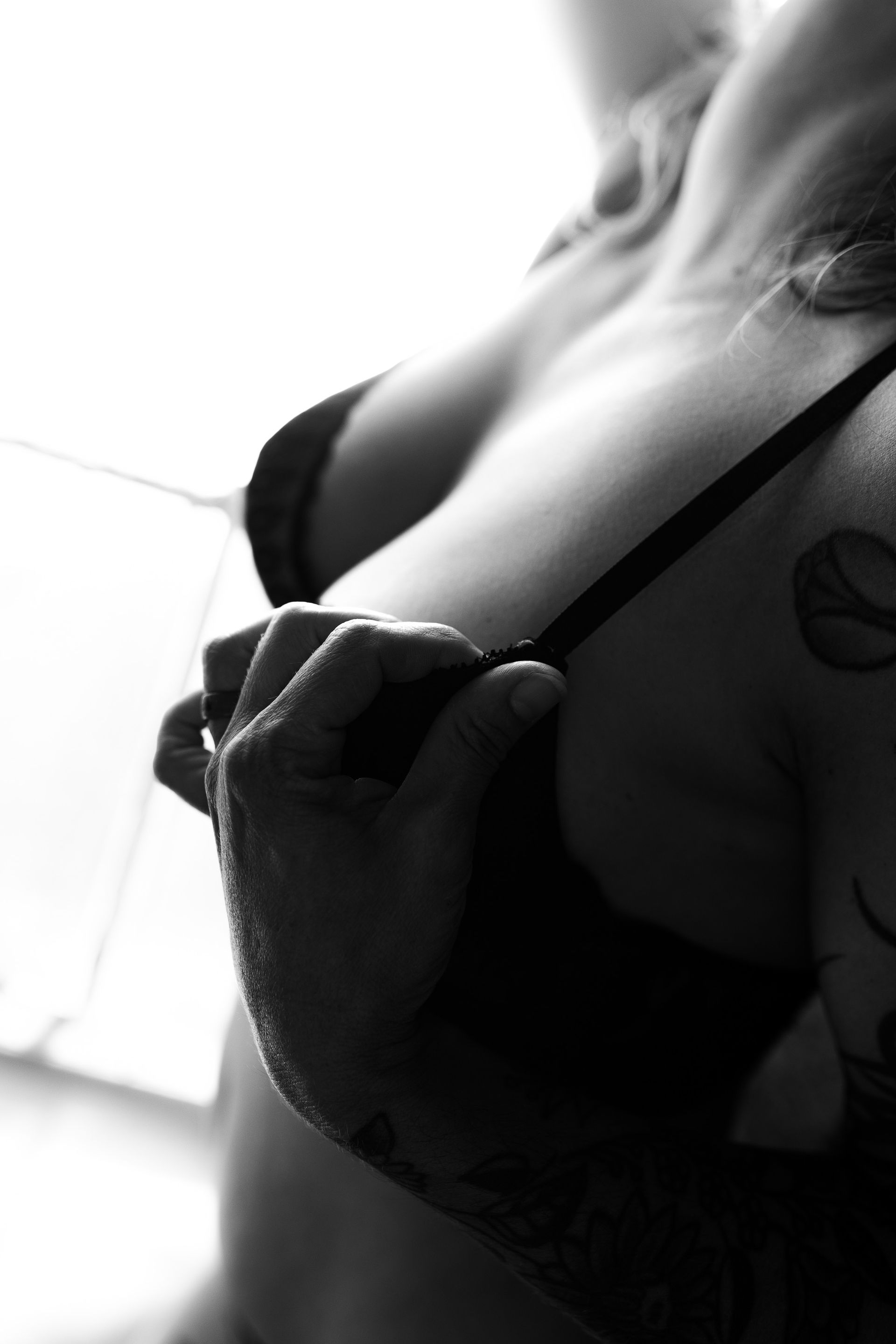 Woman posing in lingerie for boudoir session 