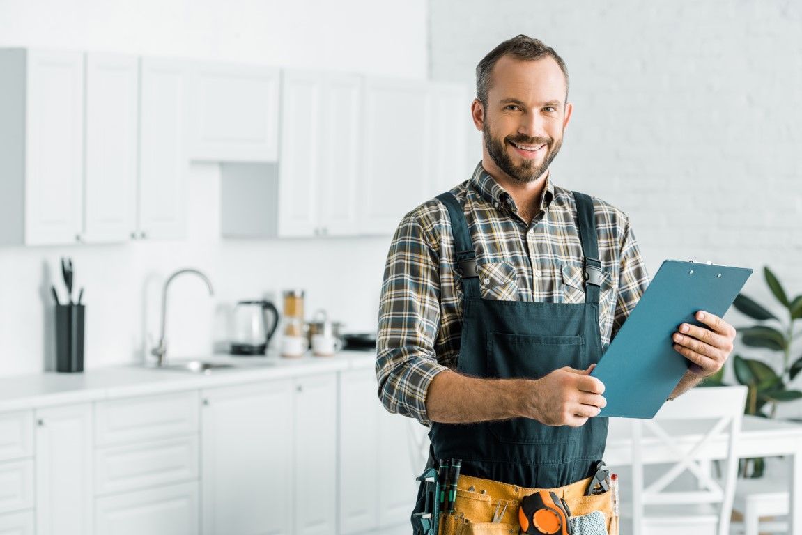 handyman has clipboard to take notes about new job