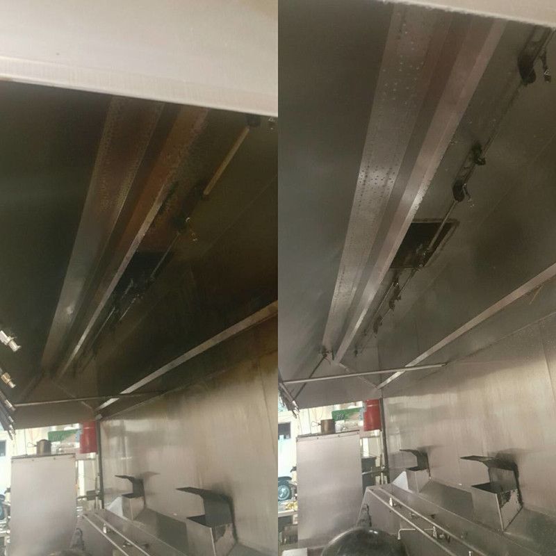 Underpass ceiling with metal beams, railings, and benches in a concrete transit area