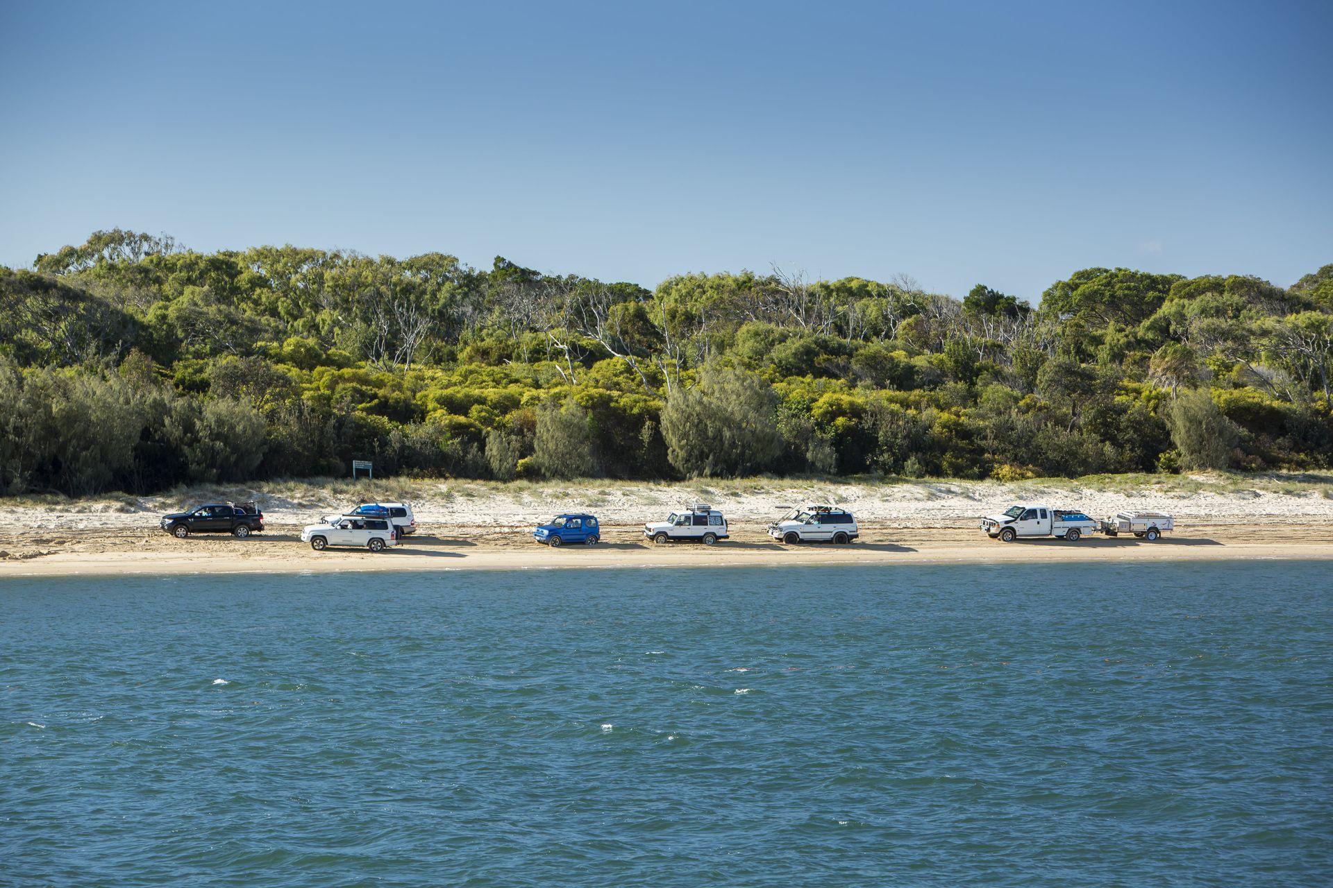Cars Parked on a Sandy Beach Next to the Water — B&D Auto Group & Towing in Ayr, QLD