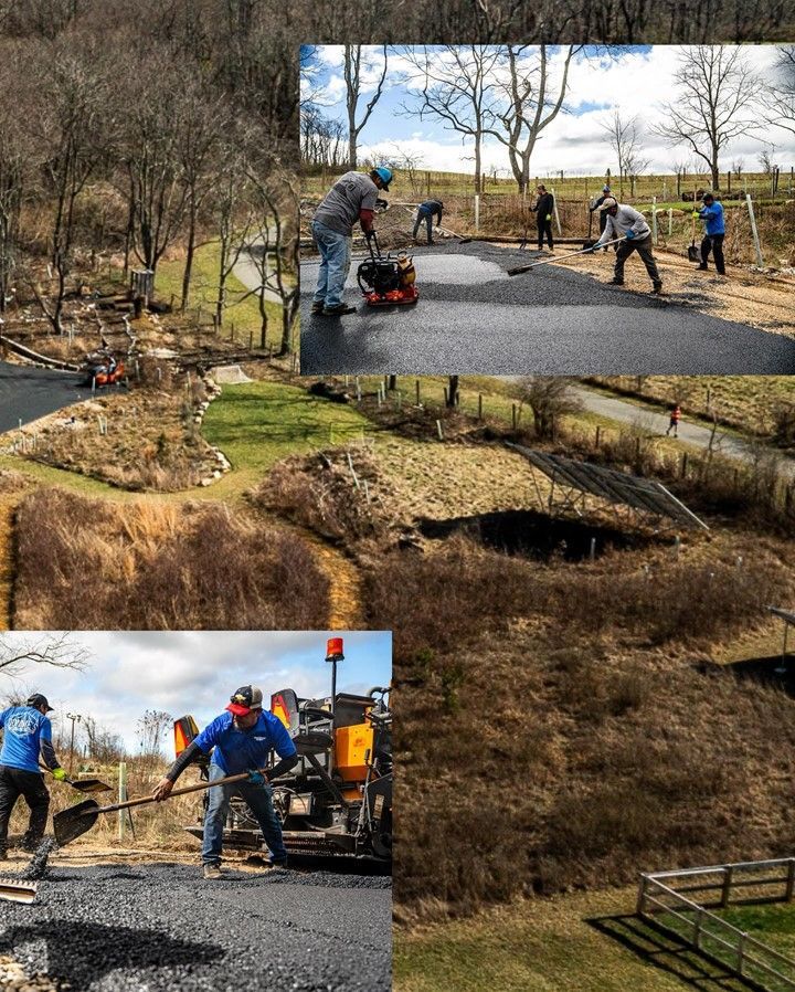 Road paving: workers laying asphalt on a road in a rural setting, with equipment and surrounding landscapes.