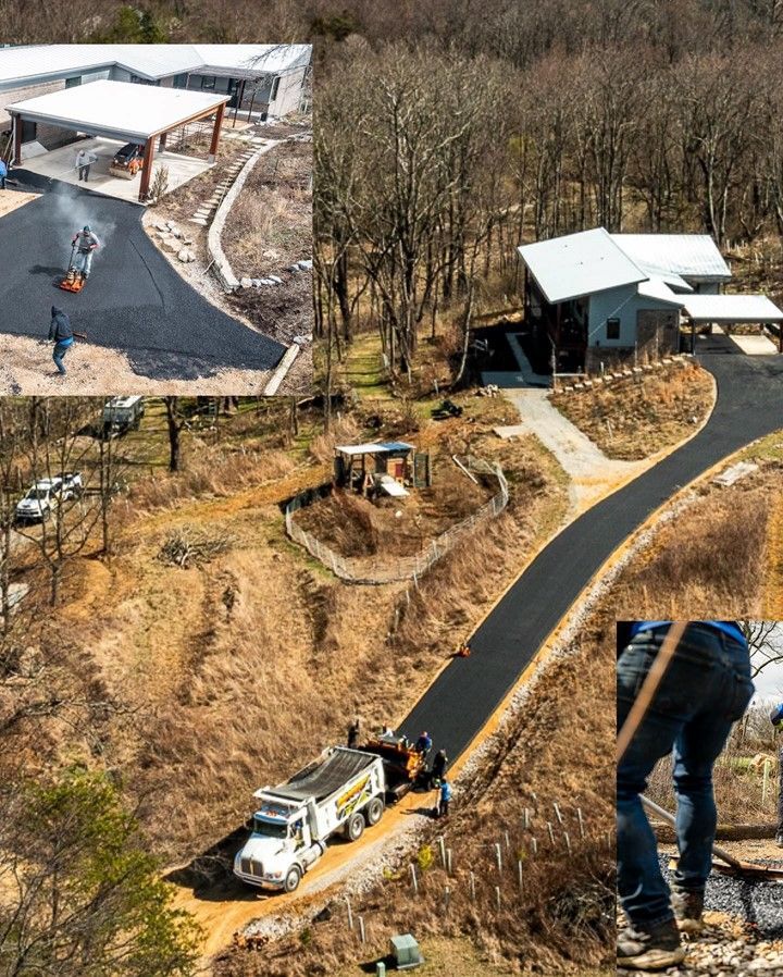 Asphalt driveway being paved, leading to a house in a wooded area. Construction crew working.