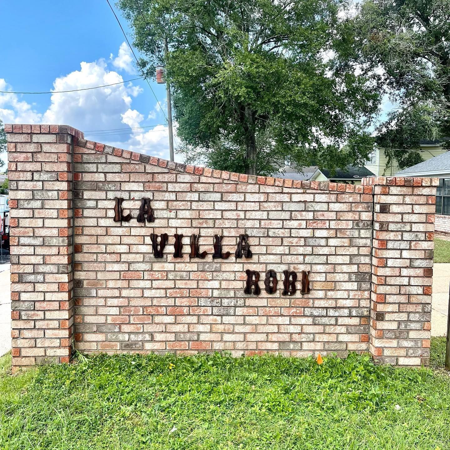 Brick wall sign that reads 