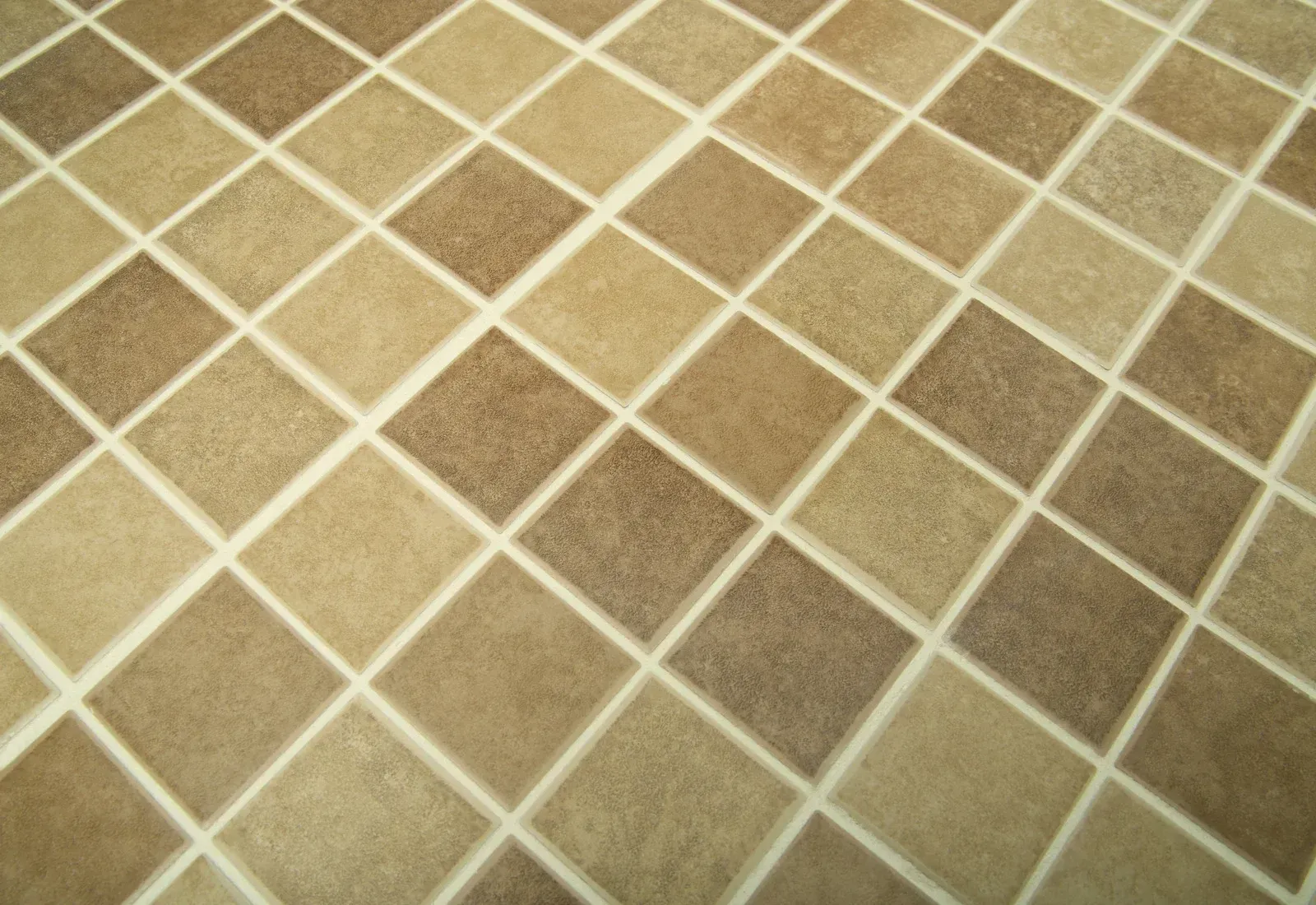 Diamond pattern floor tiles in shades of brown and beige.