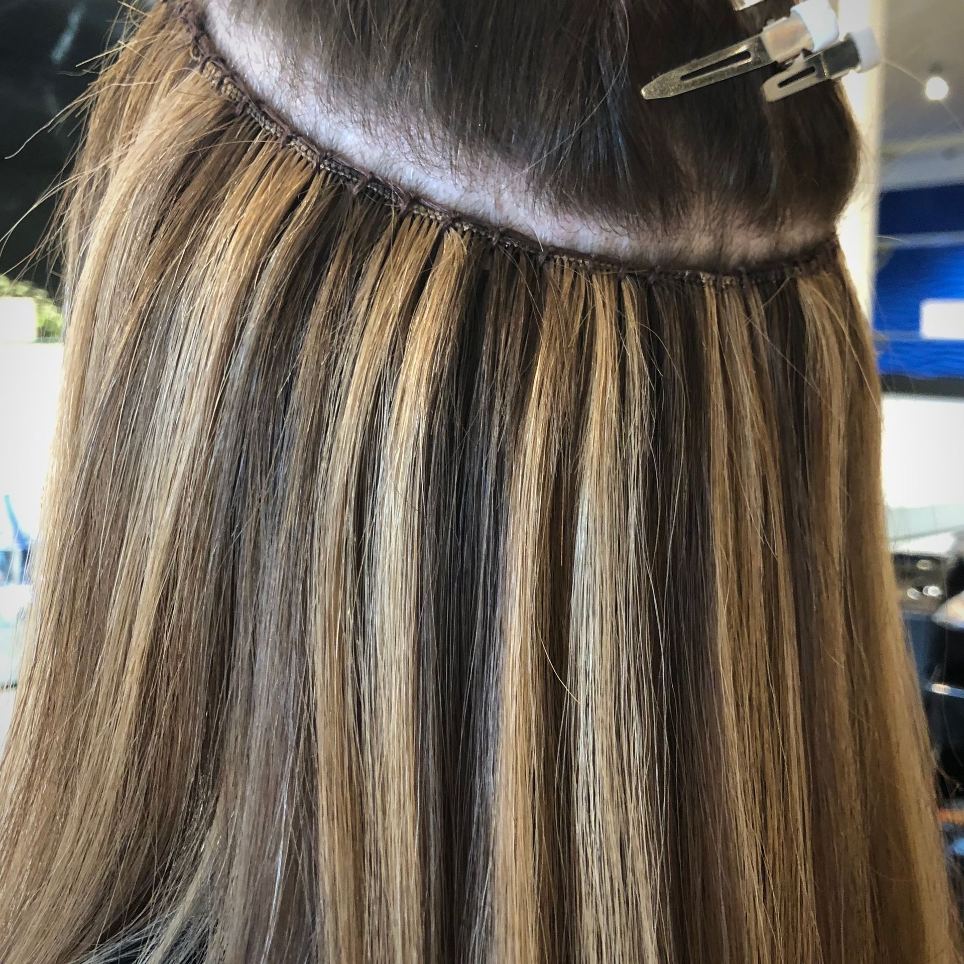 Beaded weft extensions at Süco's Hair Salon Whistler