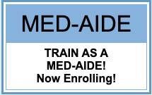Blue-and-white Med-Aide sign reads “TRAIN AS A MED-AIDE! Now Enrolling!”