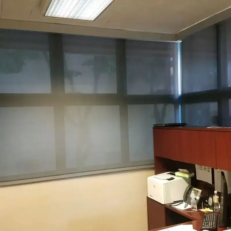 An office with a printer and a calculator on the desk