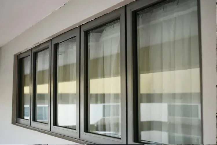 A large window with a lot of windows on a wall.