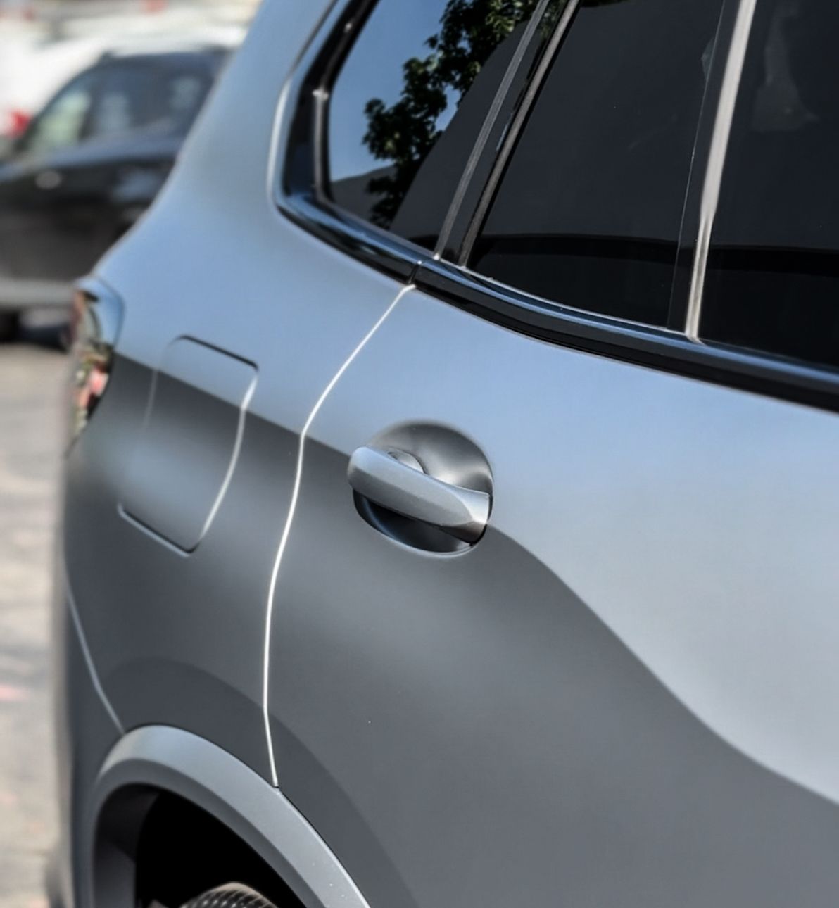 A close up of the door handle of a car