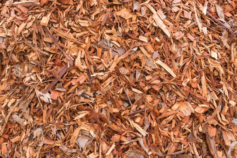 A Pile Of Wood Chips Is Sitting On The Ground — Pigot's Mid Western Sand and Soil In Orange, NSW