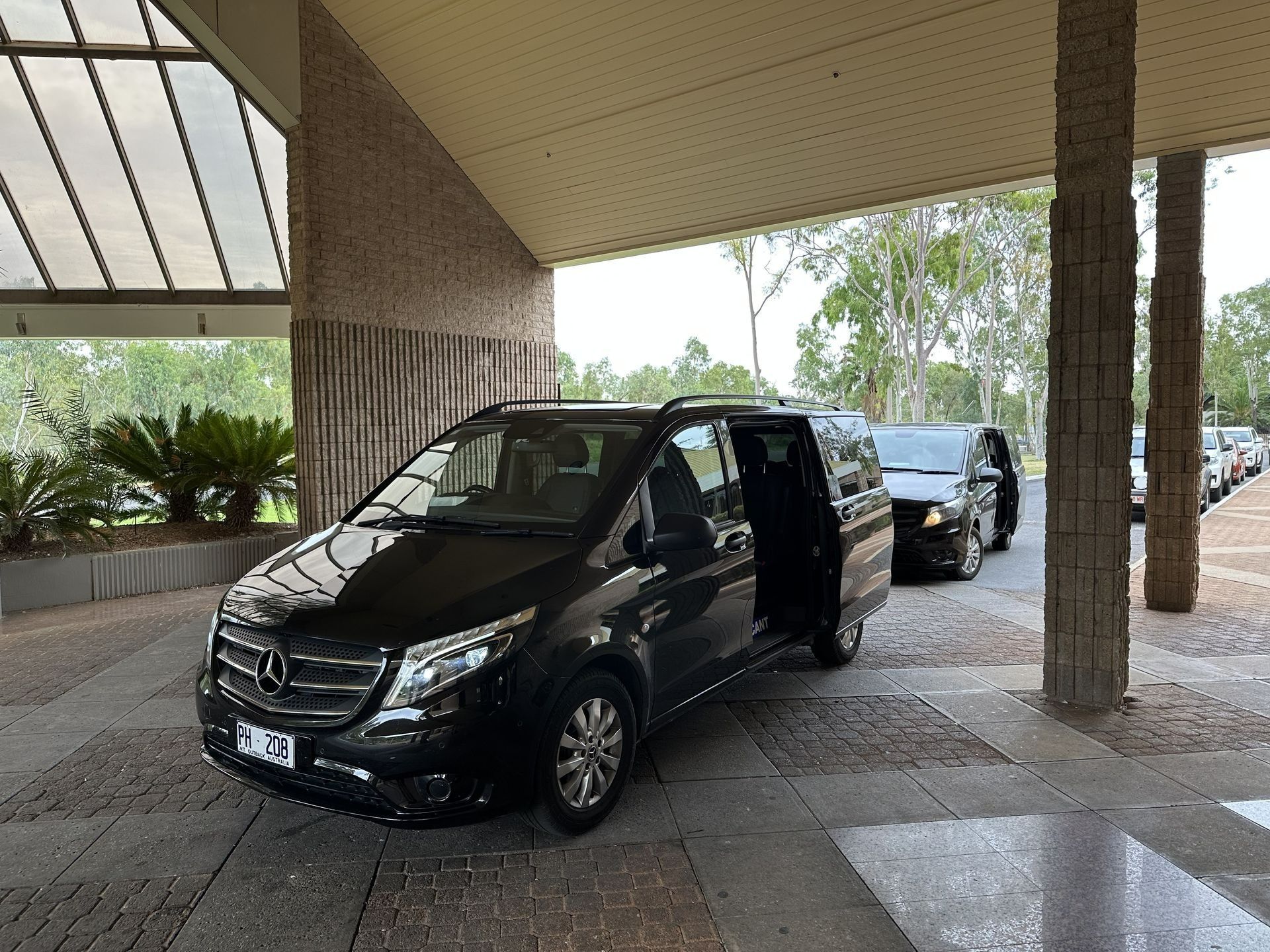 Black Mercedes Van Under a Covered Driveway With Its Side Door Open — ASP Private Hire in Ross, NT