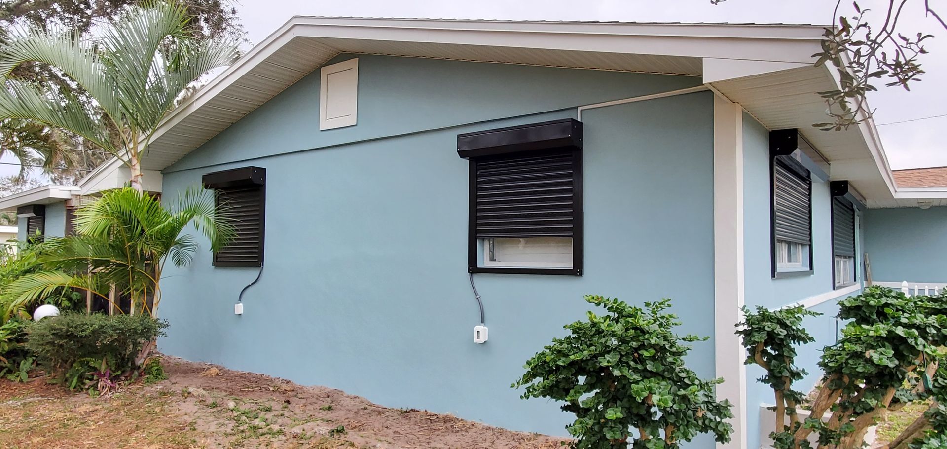 Blue House — Melbourne, FL — Roll Tite Shutters