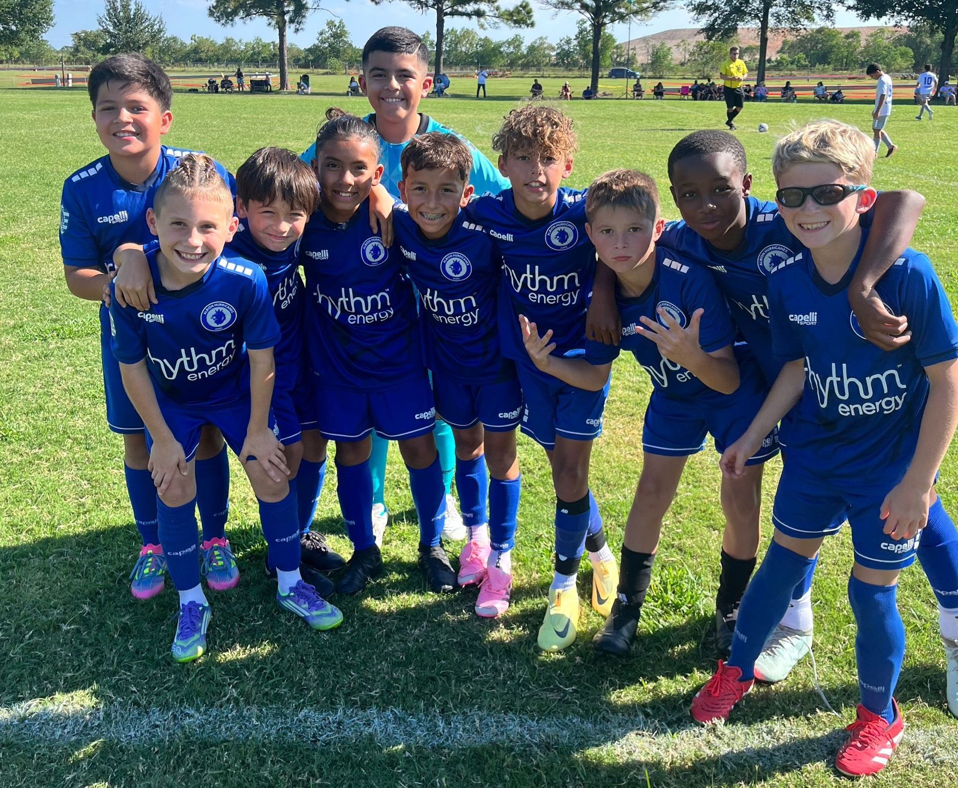 Albion Hurricanes FC team posing together on a field.