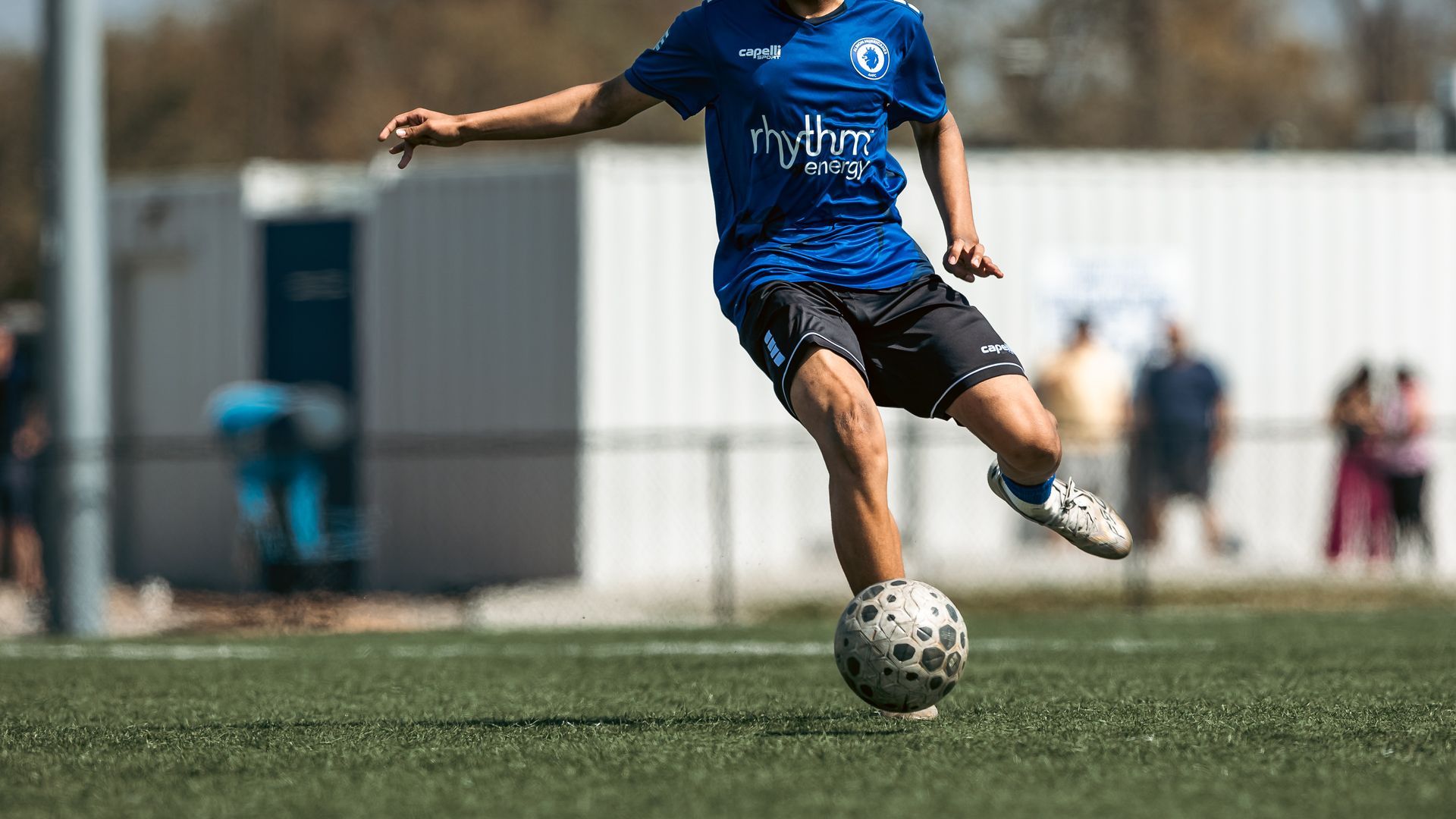 Albion Hurricanes FC youth player kicking the ball