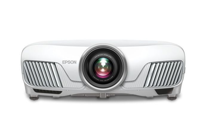 White Epson projector with central lens and side vents, front view on a white background