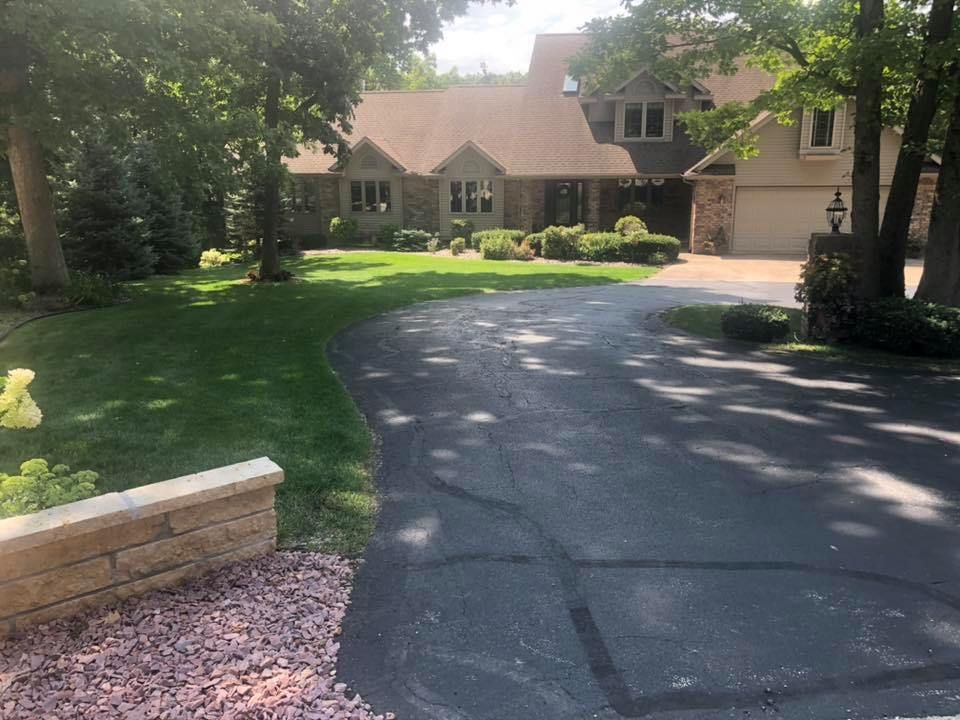 A large house with a driveway leading to it