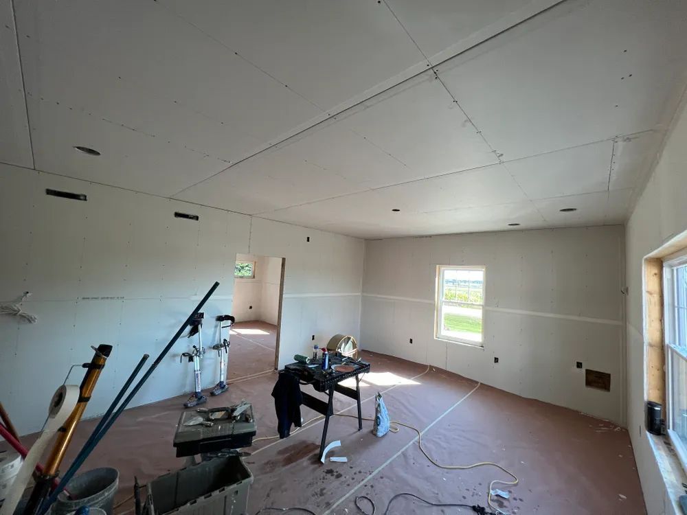 A room that is being remodeled with a lot of tools on the floor.