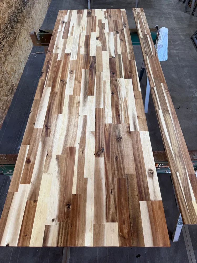 A wooden table with a lot of pieces of wood on it.