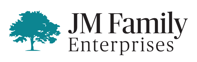 The logo for jm family enterprises has a tree on it.