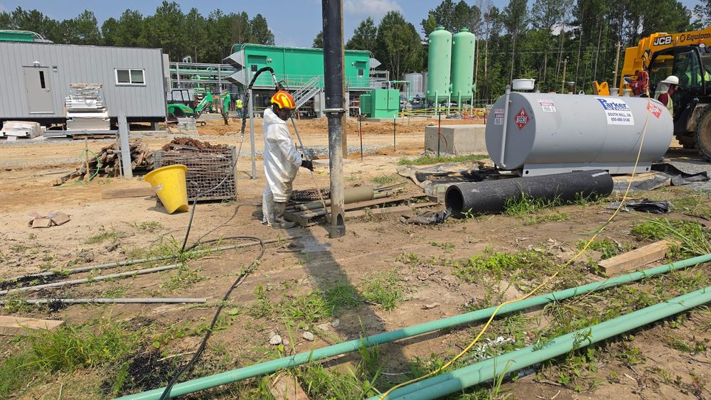 SMR Rapid Response technician in full PPE at an environmental remediation site