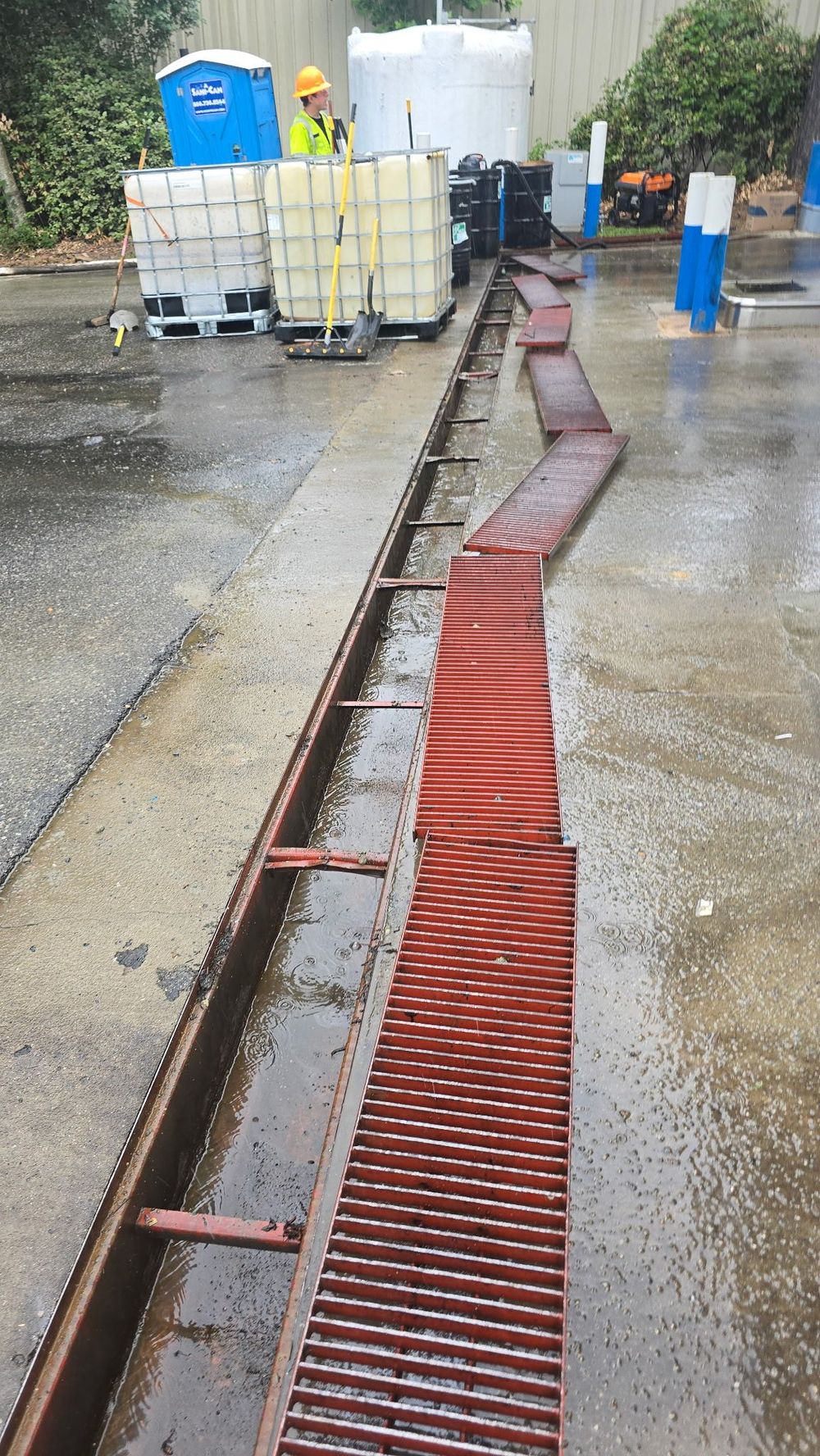 SMR Rapid Response crew cleaning out an industrial trench drain at a commercial site