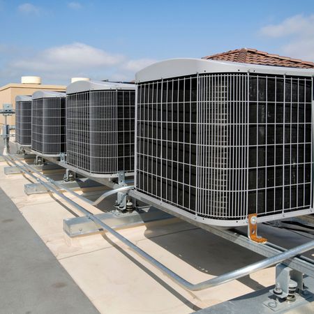 Dunn Right HVAC LLC | a row of air conditioners on the roof of a building