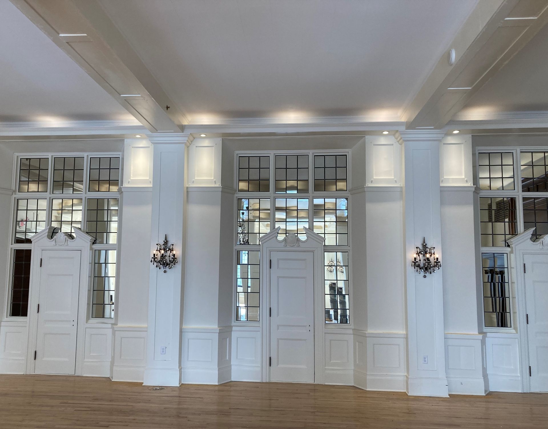 A large room with a lot of windows and doors