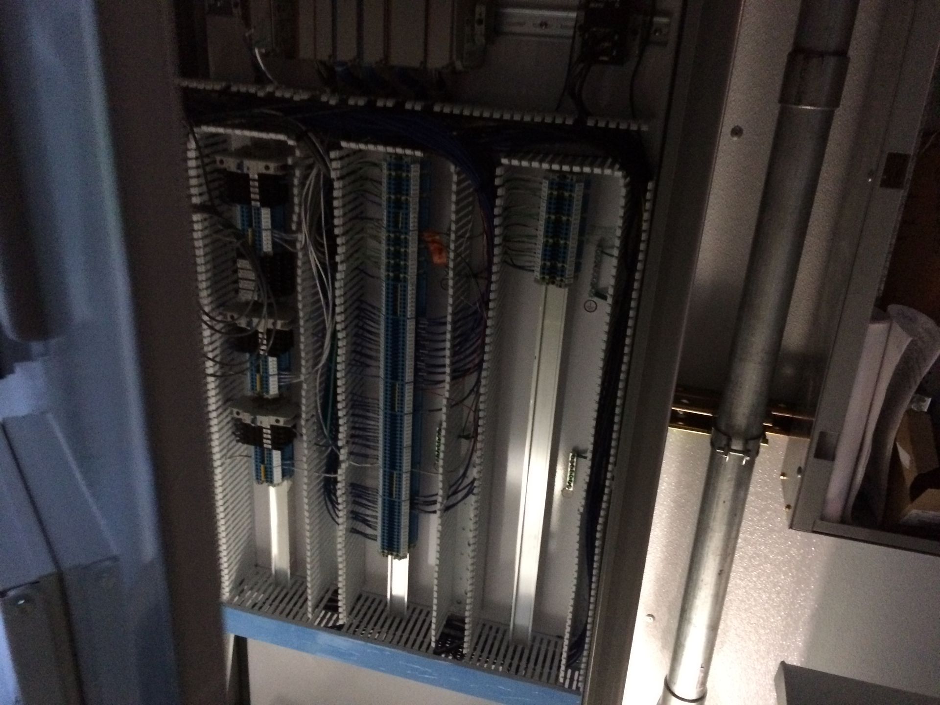 A very large electrical box with a lot of wires coming out of it
