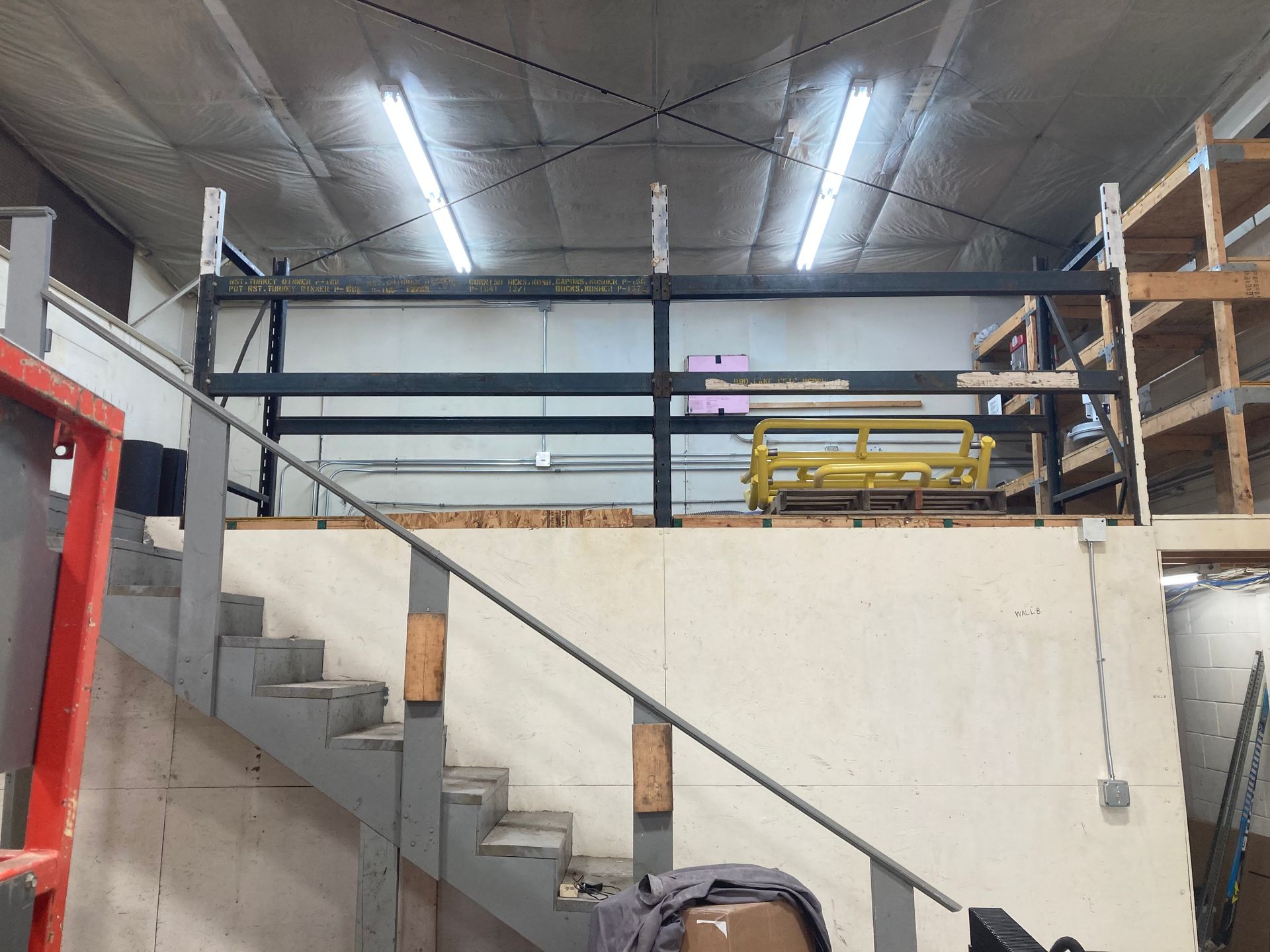 A staircase leading up to a second floor in a building.