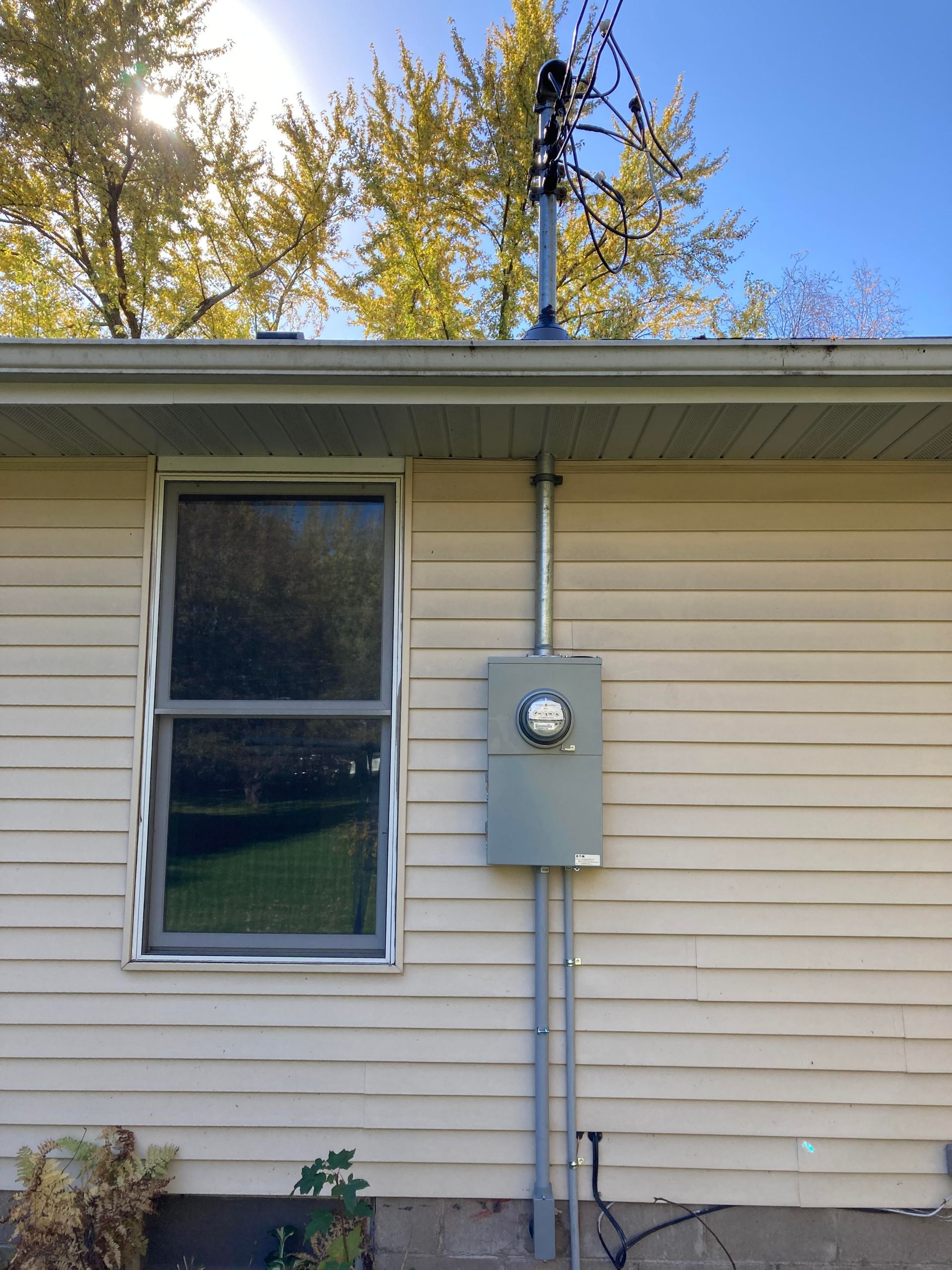 A house with a meter box on the side of it
